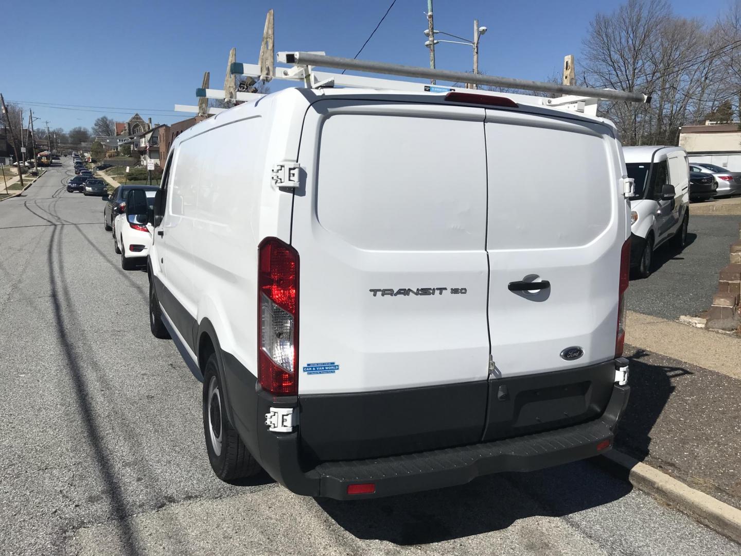 2017 White /Gray Ford Transit 150 Van Low Roof 60/40 Pass. 130-in. WB (1FTYE1ZMXHK) with an 3.7L V6 DOHC 24V engine, 6A transmission, located at 577 Chester Pike, Prospect Park, PA, 19076, (610) 237-1015, 39.886154, -75.302338 - 2017 Ford Transit 150: Ladder racks, multiple pieces of shelving, no side or rear windows, backup camera, FLEET MAINTAINED, runs LIKE NEW! This vehicle comes inspected and has been given a bumper to bumper safety check. It is very clean, reliable, and well maintained. We offer a unique pay plan t - Photo#6