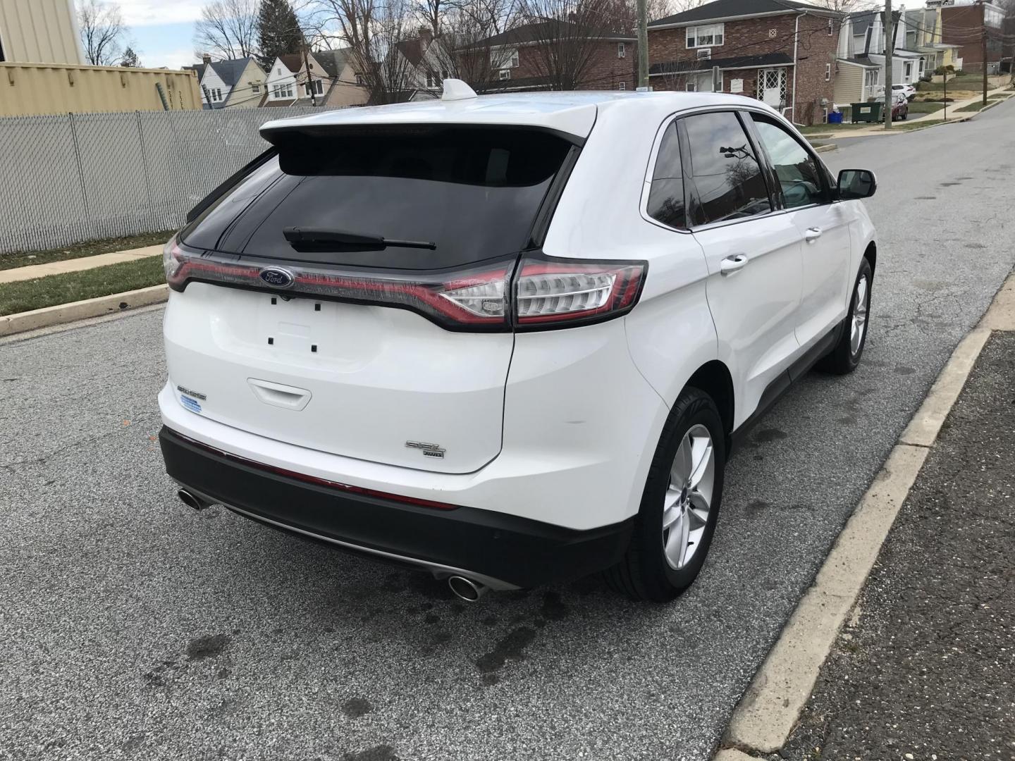 2015 White /Black Ford Edge SEL AWD (2FMTK4J89FB) with an 3.5L V6 DOHC 24V engine, 6-Speed Automatic transmission, located at 577 Chester Pike, Prospect Park, PA, 19076, (610) 237-1015, 39.886154, -75.302338 - 2015 Ford Edge SEL: AWD, backup camera, new PA inspection, SUPER CLEAN, runs LIKE NEW! This vehicle comes inspected and has been given a bumper to bumper safety check. It is very clean, reliable, and well maintained. We offer a unique pay plan that is known for being the easiest and fastest finan - Photo#4