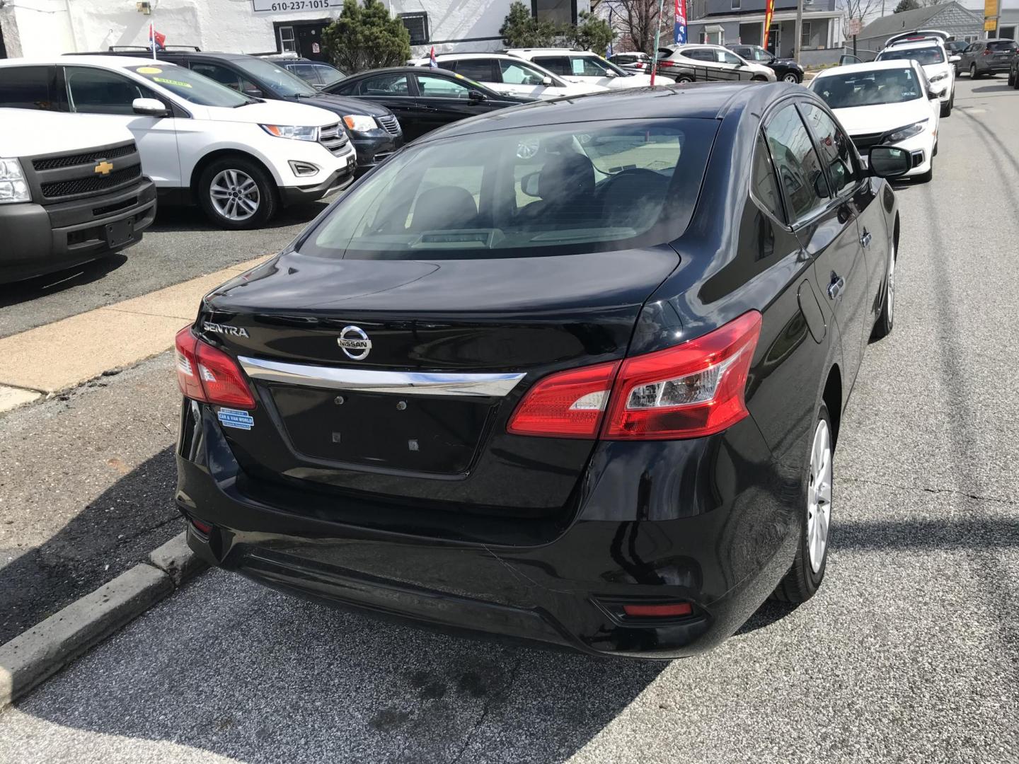 2019 Black Nissan Sentra S (3N1AB7AP6KY) with an 1.8L L4 SFI DOHC 16V engine, CVT transmission, located at 577 Chester Pike, Prospect Park, PA, 19076, (610) 237-1015, 39.886154, -75.302338 - Photo#5