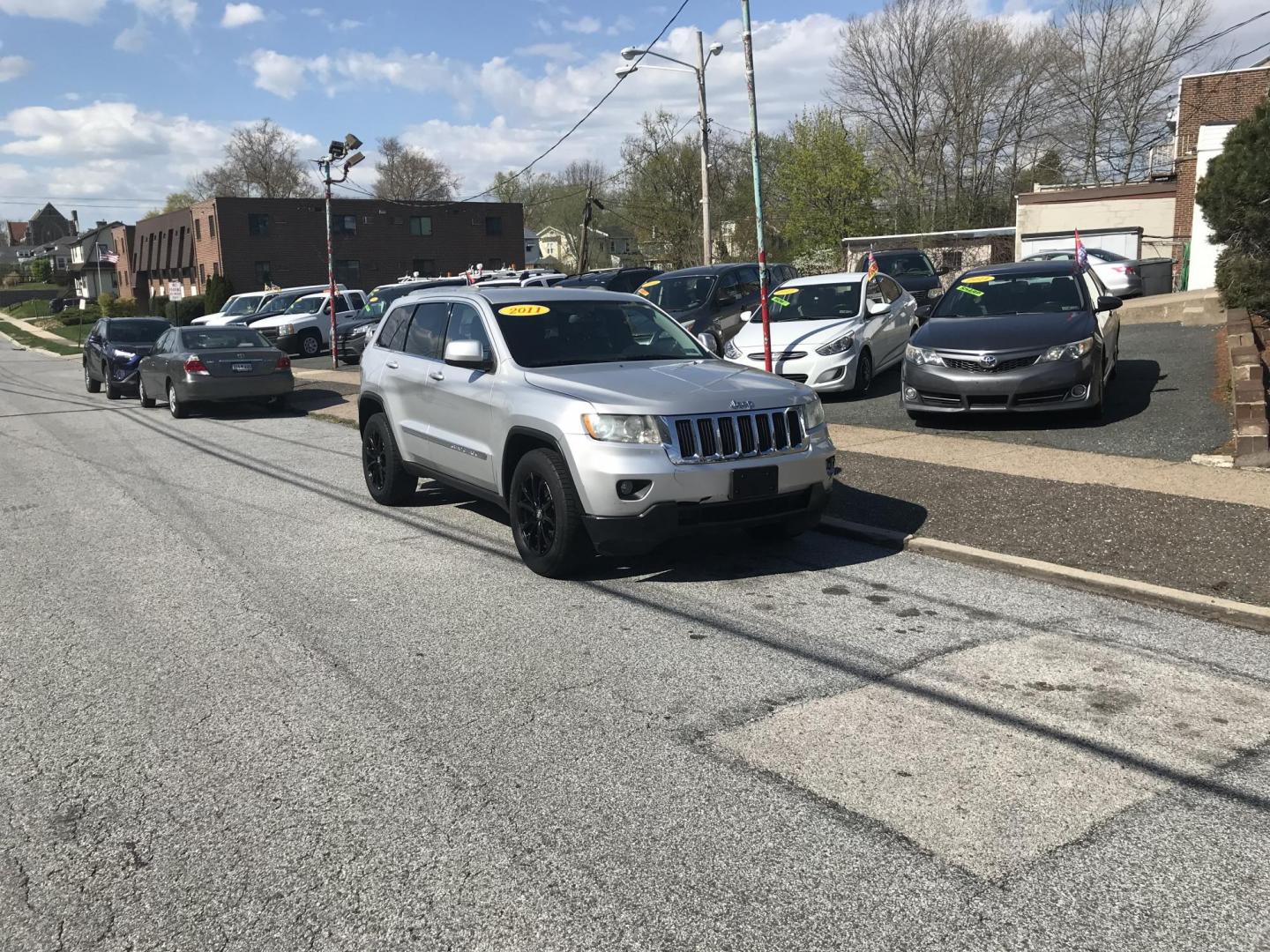 2011 Silver /Black Jeep Grand Cherokee Laredo 4WD (1J4RR4GG1BC) with an 3.6L V6 DOHC 24V engine, 5-Speed Automatic transmission, located at 577 Chester Pike, Prospect Park, PA, 19076, (610) 237-1015, 39.886154, -75.302338 - 2011 Jeep Grand Cherokee Laredo: 4x4, backup camera, black leather interior, runs LIKE NEW! This vehicle comes inspected and has been given a bumper to bumper safety check. It is very clean, reliable, and well maintained. We offer a unique pay plan that is known for being the easiest and fastest - Photo#1