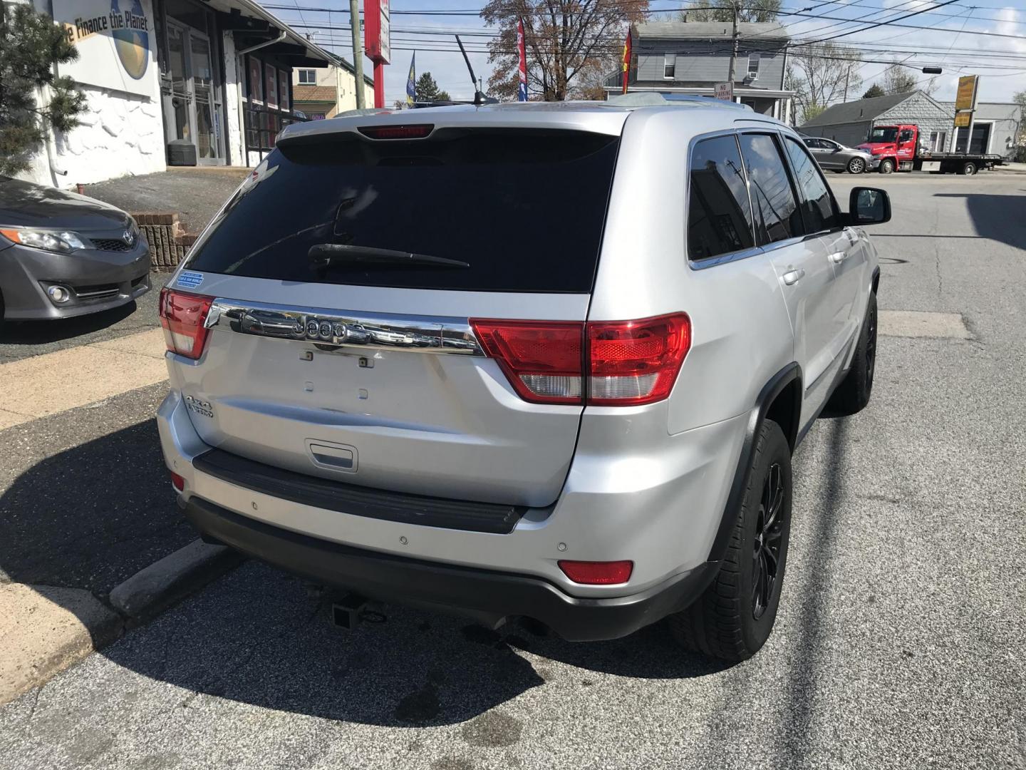 2011 Silver /Black Jeep Grand Cherokee Laredo 4WD (1J4RR4GG1BC) with an 3.6L V6 DOHC 24V engine, 5-Speed Automatic transmission, located at 577 Chester Pike, Prospect Park, PA, 19076, (610) 237-1015, 39.886154, -75.302338 - 2011 Jeep Grand Cherokee Laredo: 4x4, backup camera, black leather interior, runs LIKE NEW! This vehicle comes inspected and has been given a bumper to bumper safety check. It is very clean, reliable, and well maintained. We offer a unique pay plan that is known for being the easiest and fastest - Photo#8