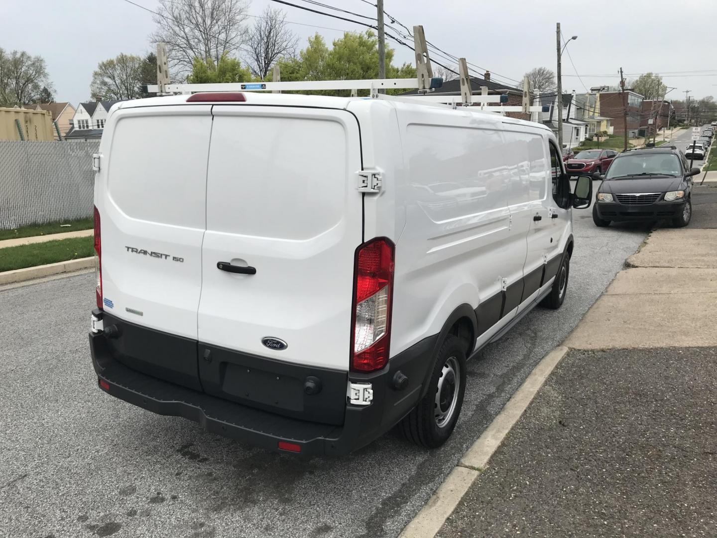2018 White /Gray Ford Transit 150 Van Low Roof 60/40 Pass. 148-in. WB (1FTYE9ZG6JK) with an 3.5L V6 DOHC 24V engine, 6A transmission, located at 577 Chester Pike, Prospect Park, PA, 19076, (610) 237-1015, 39.886154, -75.302338 - 2018 Ford Transit 150: Ladder racks, shelving, heavy duty partition, no side or rear windows, new PA inspection, FLEET MAINTAINED! This vehicle comes inspected and has been given a bumper to bumper safety check. It is very clean, reliable, and well maintained. We offer a unique pay plan that is k - Photo#4