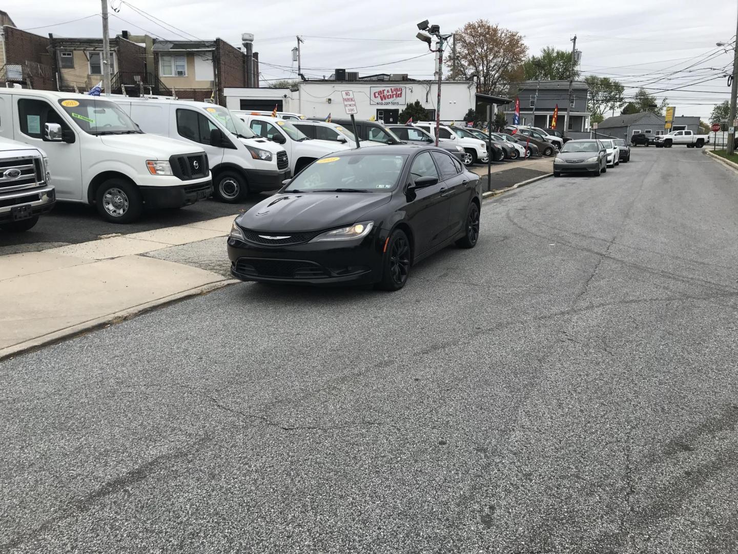 2015 Black /Black Chrysler 200 S (1C3CCCBB3FN) with an 2.4L L4 DOHC 16V engine, 9-Speed Automatic transmission, located at 577 Chester Pike, Prospect Park, PA, 19076, (610) 237-1015, 39.886154, -75.302338 - Photo#1