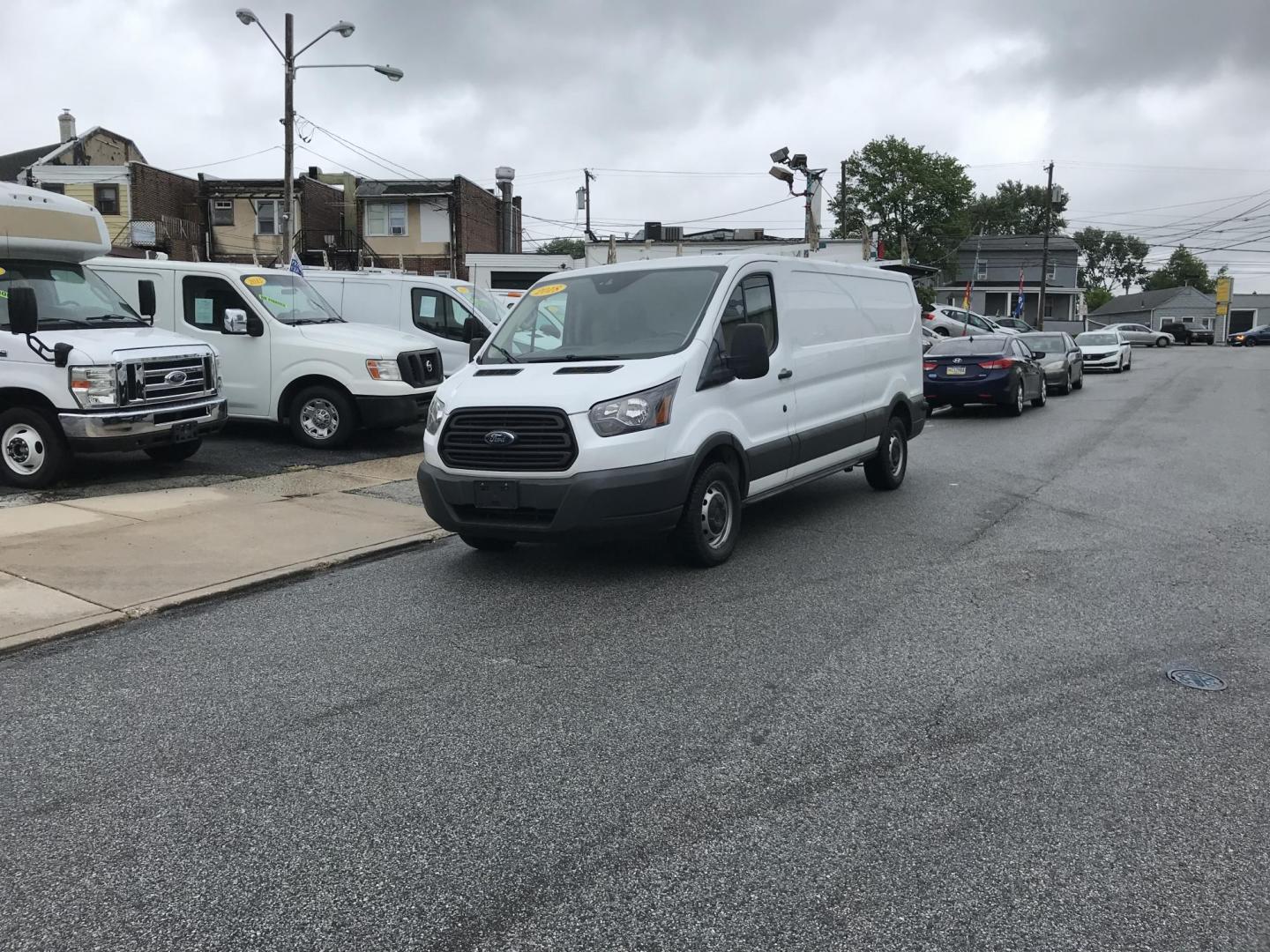 2018 White /Gray Ford Transit 150 Van Low Roof 60/40 Pass. 148-in. WB (1FTYE9ZG7JK) with an 3.5L V6 DOHC 24V engine, 6A transmission, located at 577 Chester Pike, Prospect Park, PA, 19076, (610) 237-1015, 39.886154, -75.302338 - 2018 Ford Transit 150: Extended body, ladder racks, shelving, backup camera, no side or rear windows, SUPER CLEAN, FLEET MAINTAINED! This vehicle comes inspected and has been given a bumper to bumper safety check. It is very clean, reliable, and well maintained. We offer a unique pay plan that is - Photo#1
