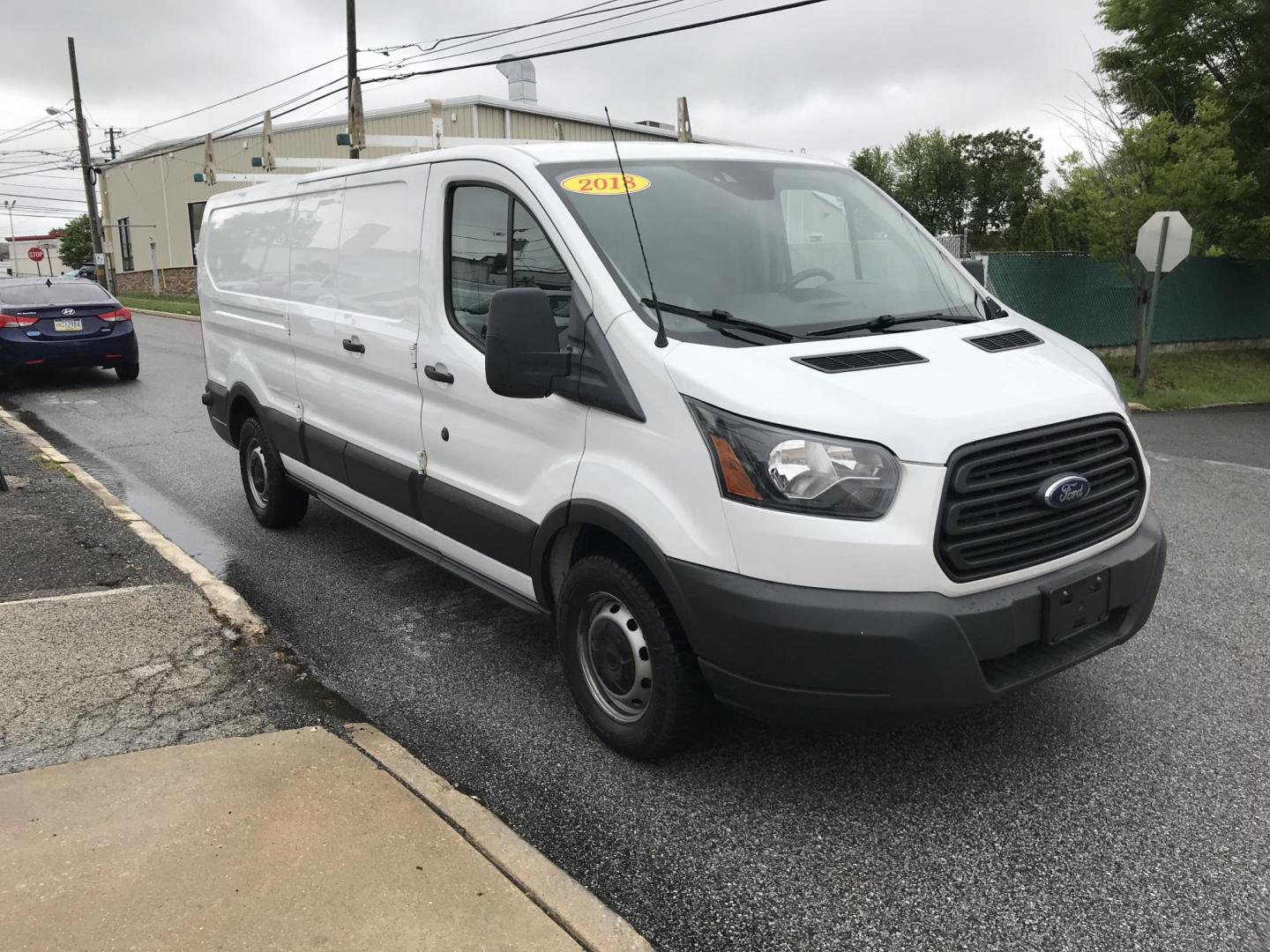 2018 White /Gray Ford Transit 150 Van Low Roof 60/40 Pass. 148-in. WB (1FTYE9ZG7JK) with an 3.5L V6 DOHC 24V engine, 6A transmission, located at 577 Chester Pike, Prospect Park, PA, 19076, (610) 237-1015, 39.886154, -75.302338 - 2018 Ford Transit 150: Extended body, ladder racks, shelving, backup camera, no side or rear windows, SUPER CLEAN, FLEET MAINTAINED! This vehicle comes inspected and has been given a bumper to bumper safety check. It is very clean, reliable, and well maintained. We offer a unique pay plan that is - Photo#3