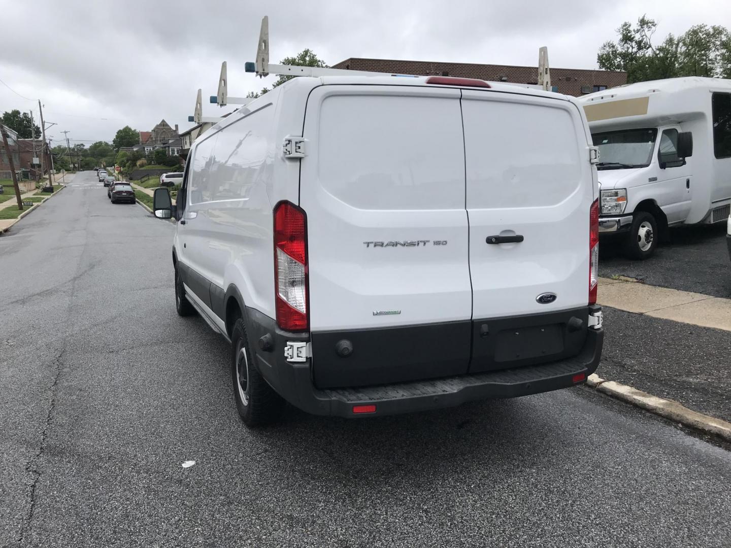 2018 White /Gray Ford Transit 150 Van Low Roof 60/40 Pass. 148-in. WB (1FTYE9ZG7JK) with an 3.5L V6 DOHC 24V engine, 6A transmission, located at 577 Chester Pike, Prospect Park, PA, 19076, (610) 237-1015, 39.886154, -75.302338 - 2018 Ford Transit 150: Extended body, ladder racks, shelving, backup camera, no side or rear windows, SUPER CLEAN, FLEET MAINTAINED! This vehicle comes inspected and has been given a bumper to bumper safety check. It is very clean, reliable, and well maintained. We offer a unique pay plan that is - Photo#5