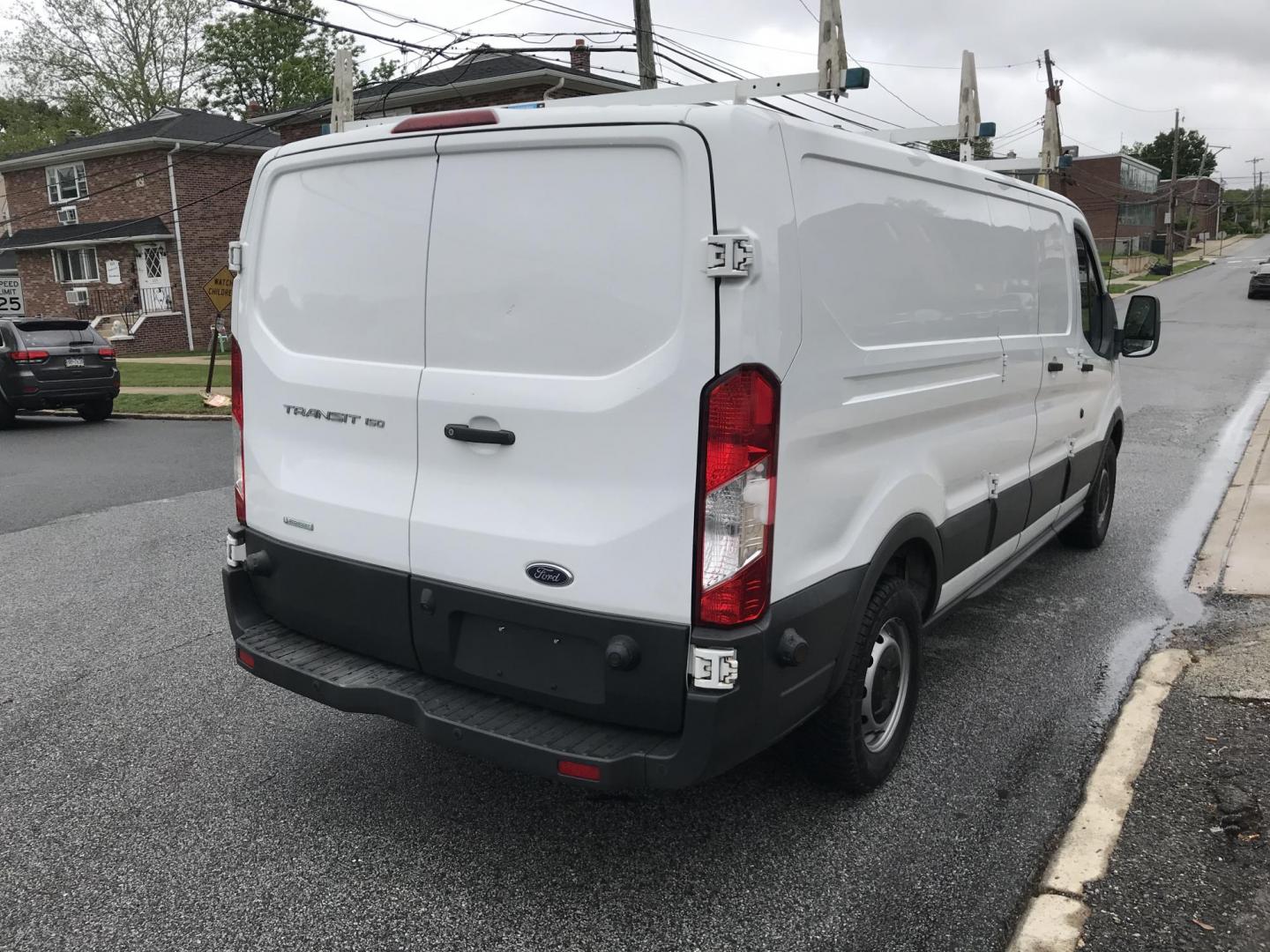 2018 White /Gray Ford Transit 150 Van Low Roof 60/40 Pass. 148-in. WB (1FTYE9ZG7JK) with an 3.5L V6 DOHC 24V engine, 6A transmission, located at 577 Chester Pike, Prospect Park, PA, 19076, (610) 237-1015, 39.886154, -75.302338 - 2018 Ford Transit 150: Extended body, ladder racks, shelving, backup camera, no side or rear windows, SUPER CLEAN, FLEET MAINTAINED! This vehicle comes inspected and has been given a bumper to bumper safety check. It is very clean, reliable, and well maintained. We offer a unique pay plan that is - Photo#4