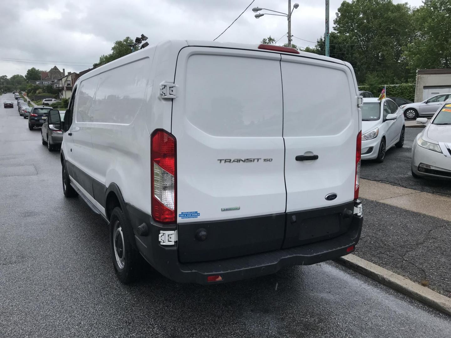 2016 White /Gray Ford Transit 150 Van Low Roof 60/40 Pass. 148-in. WB (1FTYE9ZG1GK) with an 3.5L V6 DOHC 24V engine, 6A transmission, located at 577 Chester Pike, Prospect Park, PA, 19076, (610) 237-1015, 39.886154, -75.302338 - 2016 Ford Transit 150: Extended body, backup camera, no side or rear windows, shelving, partition, FLEET MAINTAINED, RUNS LIKE NEW! This vehicle comes inspected and has been given a bumper to bumper safety check. It is very clean, reliable, and well maintained. We offer a unique pay plan that is - Photo#5