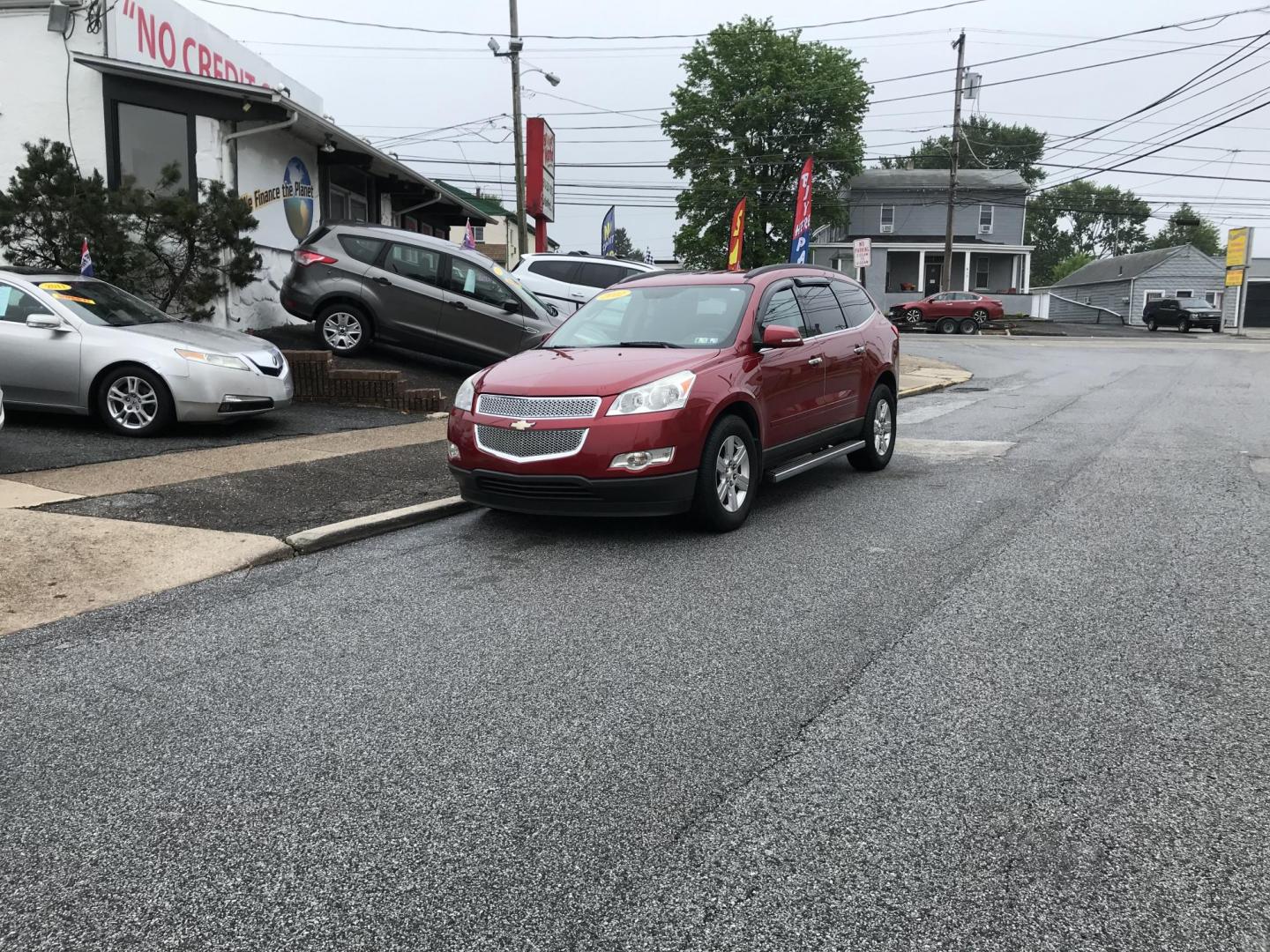 2012 Red /Gray Chevrolet Traverse LT AWD (1GNKVGED9CJ) with an 3.6L V6 DOHC 24V engine, 6-Speed Automatic transmission, located at 577 Chester Pike, Prospect Park, PA, 19076, (610) 237-1015, 39.886154, -75.302338 - 2012 Chevy Traverse LT: AWD, 3rd row seating, backup camera, new PA inspection, SUPER CLEAN, runs LIKE NEW! This vehicle comes inspected and has been given a bumper to bumper safety check. It is very clean, reliable, and well maintained. We offer a unique pay plan that is known for being the easi - Photo#1