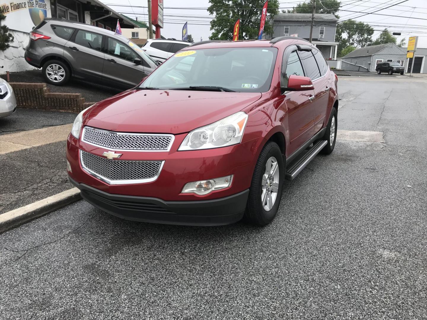 2012 Red /Gray Chevrolet Traverse LT AWD (1GNKVGED9CJ) with an 3.6L V6 DOHC 24V engine, 6-Speed Automatic transmission, located at 577 Chester Pike, Prospect Park, PA, 19076, (610) 237-1015, 39.886154, -75.302338 - 2012 Chevy Traverse LT: AWD, 3rd row seating, backup camera, new PA inspection, SUPER CLEAN, runs LIKE NEW! This vehicle comes inspected and has been given a bumper to bumper safety check. It is very clean, reliable, and well maintained. We offer a unique pay plan that is known for being the easi - Photo#2