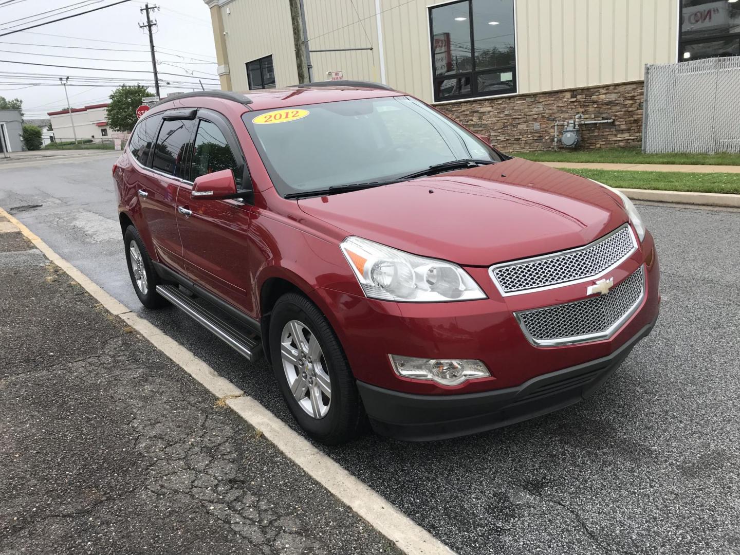 2012 Red /Gray Chevrolet Traverse LT AWD (1GNKVGED9CJ) with an 3.6L V6 DOHC 24V engine, 6-Speed Automatic transmission, located at 577 Chester Pike, Prospect Park, PA, 19076, (610) 237-1015, 39.886154, -75.302338 - 2012 Chevy Traverse LT: AWD, 3rd row seating, backup camera, new PA inspection, SUPER CLEAN, runs LIKE NEW! This vehicle comes inspected and has been given a bumper to bumper safety check. It is very clean, reliable, and well maintained. We offer a unique pay plan that is known for being the easi - Photo#3