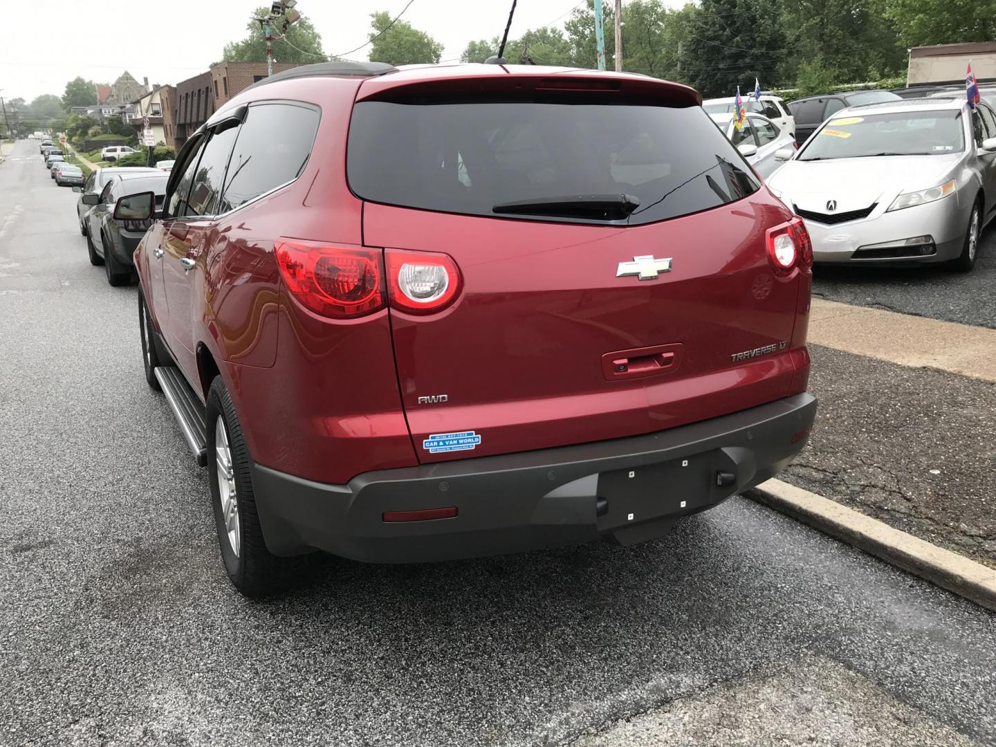2012 Red /Gray Chevrolet Traverse LT AWD (1GNKVGED9CJ) with an 3.6L V6 DOHC 24V engine, 6-Speed Automatic transmission, located at 577 Chester Pike, Prospect Park, PA, 19076, (610) 237-1015, 39.886154, -75.302338 - 2012 Chevy Traverse LT: AWD, 3rd row seating, backup camera, new PA inspection, SUPER CLEAN, runs LIKE NEW! This vehicle comes inspected and has been given a bumper to bumper safety check. It is very clean, reliable, and well maintained. We offer a unique pay plan that is known for being the easi - Photo#5