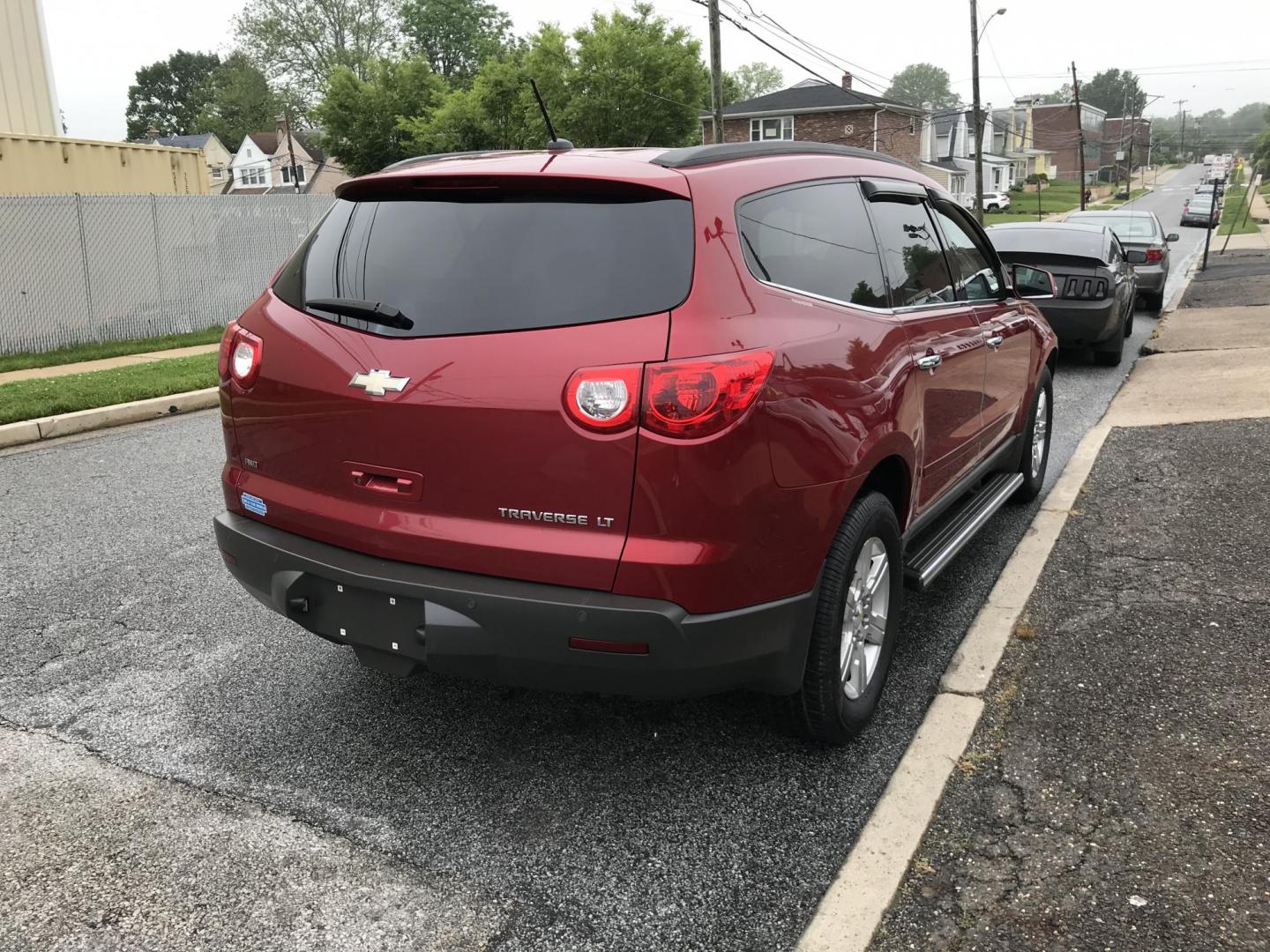 2012 Red /Gray Chevrolet Traverse LT AWD (1GNKVGED9CJ) with an 3.6L V6 DOHC 24V engine, 6-Speed Automatic transmission, located at 577 Chester Pike, Prospect Park, PA, 19076, (610) 237-1015, 39.886154, -75.302338 - 2012 Chevy Traverse LT: AWD, 3rd row seating, backup camera, new PA inspection, SUPER CLEAN, runs LIKE NEW! This vehicle comes inspected and has been given a bumper to bumper safety check. It is very clean, reliable, and well maintained. We offer a unique pay plan that is known for being the easi - Photo#4