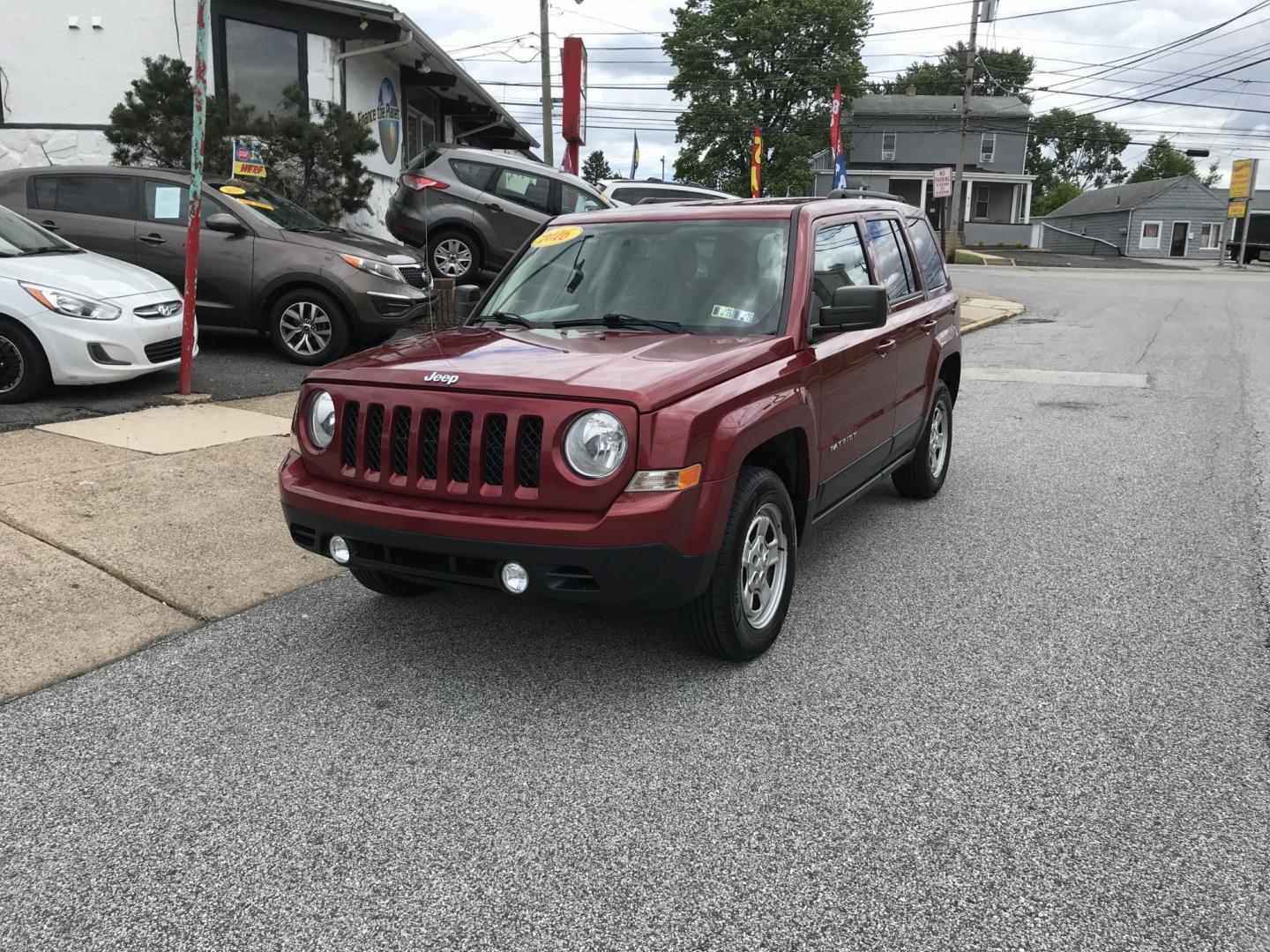 2016 Red /Gray Jeep Patriot Sport 4WD (1C4NJRBB7GD) with an 2.4L L4 DOHC 16V engine, Automatic transmission, located at 577 Chester Pike, Prospect Park, PA, 19076, (610) 237-1015, 39.886154, -75.302338 - 2016 Jeep Patriot Sport: remote start, 4x4, new PA inspection, great on gas, SUPER CLEAN, runs LIKE NEW! This vehicle comes inspected and has been given a bumper to bumper safety check. It is very clean, reliable, and well maintained. We offer a unique pay plan that is known for being the easiest - Photo#2