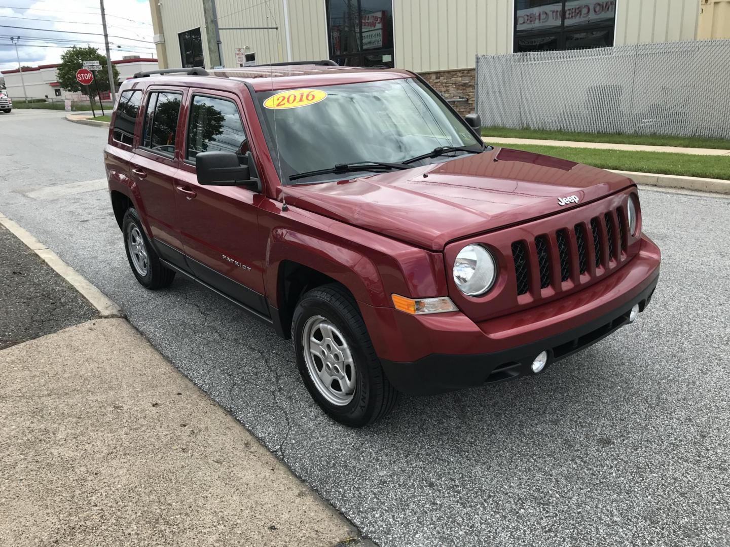 2016 Red /Gray Jeep Patriot Sport 4WD (1C4NJRBB7GD) with an 2.4L L4 DOHC 16V engine, Automatic transmission, located at 577 Chester Pike, Prospect Park, PA, 19076, (610) 237-1015, 39.886154, -75.302338 - 2016 Jeep Patriot Sport: remote start, 4x4, new PA inspection, great on gas, SUPER CLEAN, runs LIKE NEW! This vehicle comes inspected and has been given a bumper to bumper safety check. It is very clean, reliable, and well maintained. We offer a unique pay plan that is known for being the easiest - Photo#3