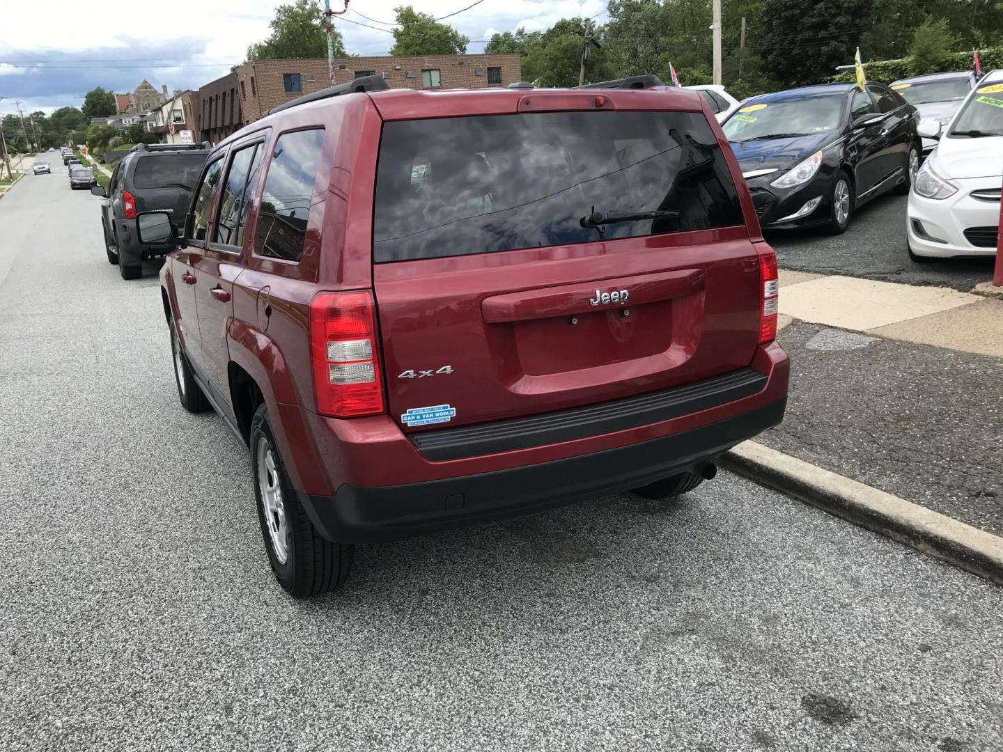2016 Red /Gray Jeep Patriot Sport 4WD (1C4NJRBB7GD) with an 2.4L L4 DOHC 16V engine, Automatic transmission, located at 577 Chester Pike, Prospect Park, PA, 19076, (610) 237-1015, 39.886154, -75.302338 - 2016 Jeep Patriot Sport: remote start, 4x4, new PA inspection, great on gas, SUPER CLEAN, runs LIKE NEW! This vehicle comes inspected and has been given a bumper to bumper safety check. It is very clean, reliable, and well maintained. We offer a unique pay plan that is known for being the easiest - Photo#5