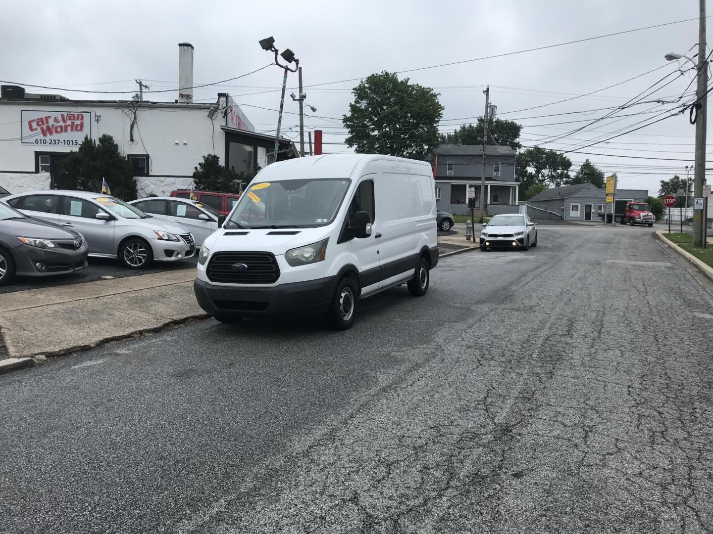 2015 White /Gray Ford Transit 150 Van Med. Roof w/Sliding Pass. 130-in. WB (1FTNE1CM3FK) with an 3.7L V6 DOHC 24V engine, 6-Speed Automatic transmission, located at 577 Chester Pike, Prospect Park, PA, 19076, (610) 237-1015, 39.886154, -75.302338 - 2015 Ford Transit Medium Roof: Fleet maintained van, new PA inspection, runs LIKE NEW! This vehicle comes inspected and has been given a bumper to bumper safety check. It is very clean, reliable, and well maintained. We offer a unique pay plan that is known for being the easiest and fastest finan - Photo#1
