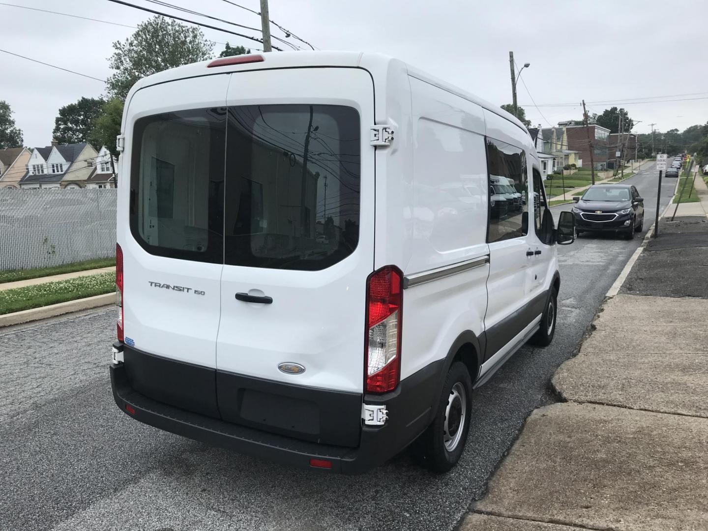 2015 White /Gray Ford Transit 150 Van Med. Roof w/Sliding Pass. 130-in. WB (1FTNE1CM3FK) with an 3.7L V6 DOHC 24V engine, 6-Speed Automatic transmission, located at 577 Chester Pike, Prospect Park, PA, 19076, (610) 237-1015, 39.886154, -75.302338 - 2015 Ford Transit Medium Roof: Fleet maintained van, new PA inspection, runs LIKE NEW! This vehicle comes inspected and has been given a bumper to bumper safety check. It is very clean, reliable, and well maintained. We offer a unique pay plan that is known for being the easiest and fastest finan - Photo#4