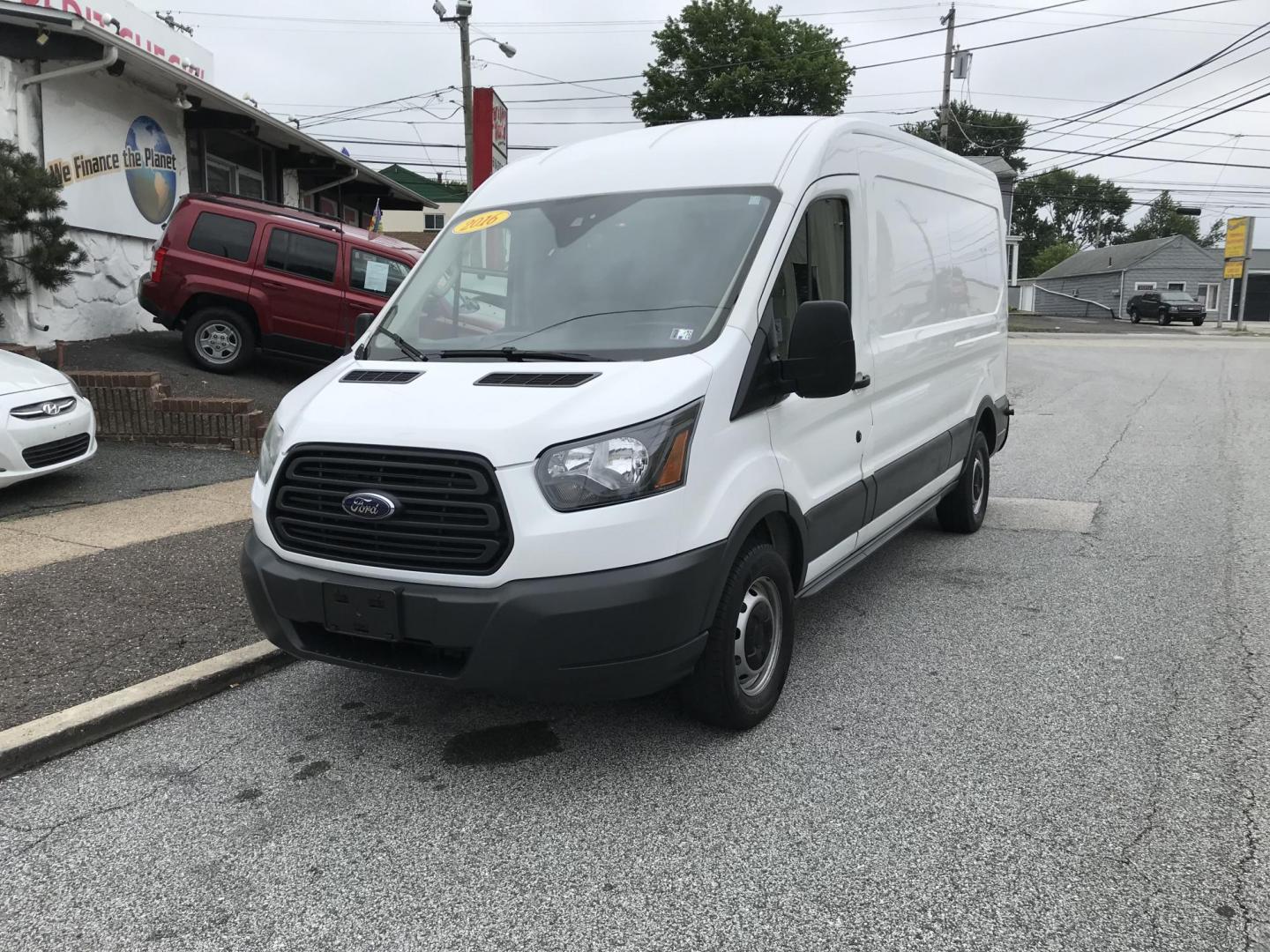 2016 White /Gray Ford Transit 250 Van Med. Roof w/Sliding Pass. 148-in. WB (1FTYR2CM1GK) with an 3.7L V6 DOHC 24V engine, 6-Speed Automatic transmission, located at 577 Chester Pike, Prospect Park, PA, 19076, (610) 237-1015, 39.886154, -75.302338 - 2016 Ford Transit 250 Medium Roof: Has shelving, new PA inspection, no side or rear windows, FLEET MAINTAINED, runs LIKE NEW! This vehicle comes inspected and has been given a bumper to bumper safety check. It is very clean, reliable, and well maintained. We offer a unique pay plan that is known - Photo#2