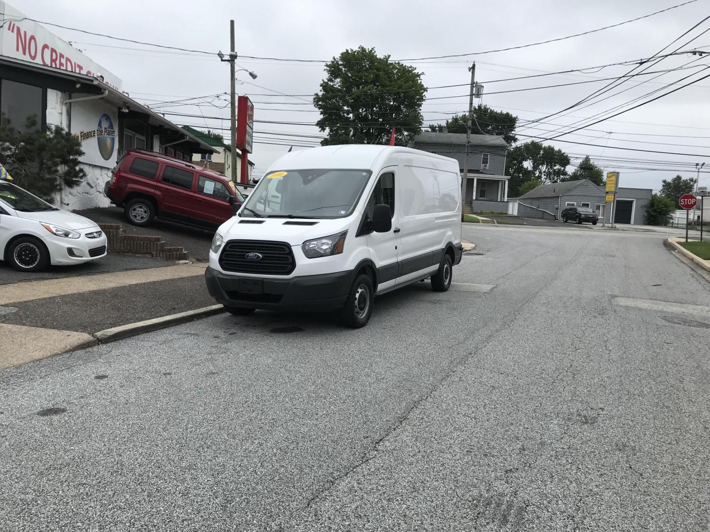 2016 White /Gray Ford Transit 250 Van Med. Roof w/Sliding Pass. 148-in. WB (1FTYR2CM1GK) with an 3.7L V6 DOHC 24V engine, 6-Speed Automatic transmission, located at 577 Chester Pike, Prospect Park, PA, 19076, (610) 237-1015, 39.886154, -75.302338 - 2016 Ford Transit 250 Medium Roof: Has shelving, new PA inspection, no side or rear windows, FLEET MAINTAINED, runs LIKE NEW! This vehicle comes inspected and has been given a bumper to bumper safety check. It is very clean, reliable, and well maintained. We offer a unique pay plan that is known - Photo#1