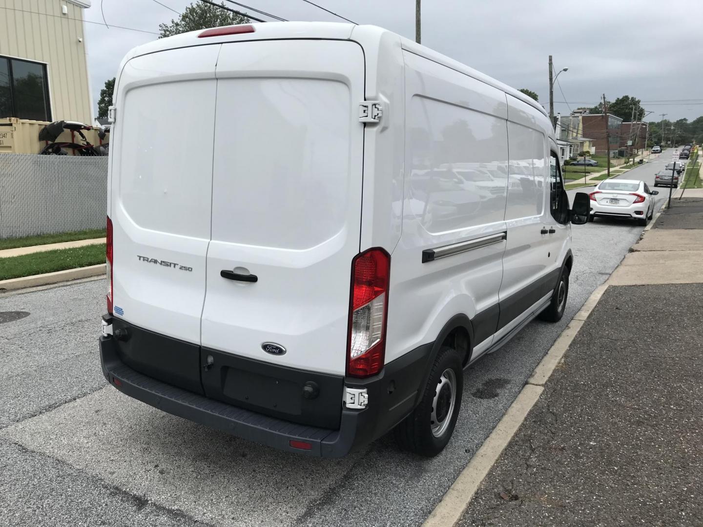 2016 White /Gray Ford Transit 250 Van Med. Roof w/Sliding Pass. 148-in. WB (1FTYR2CM1GK) with an 3.7L V6 DOHC 24V engine, 6-Speed Automatic transmission, located at 577 Chester Pike, Prospect Park, PA, 19076, (610) 237-1015, 39.886154, -75.302338 - 2016 Ford Transit 250 Medium Roof: Has shelving, new PA inspection, no side or rear windows, FLEET MAINTAINED, runs LIKE NEW! This vehicle comes inspected and has been given a bumper to bumper safety check. It is very clean, reliable, and well maintained. We offer a unique pay plan that is known - Photo#4