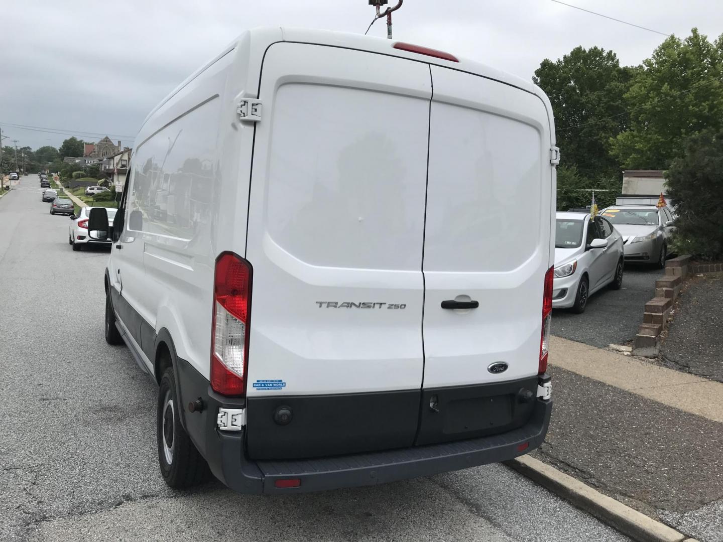 2016 White /Gray Ford Transit 250 Van Med. Roof w/Sliding Pass. 148-in. WB (1FTYR2CM1GK) with an 3.7L V6 DOHC 24V engine, 6-Speed Automatic transmission, located at 577 Chester Pike, Prospect Park, PA, 19076, (610) 237-1015, 39.886154, -75.302338 - 2016 Ford Transit 250 Medium Roof: Has shelving, new PA inspection, no side or rear windows, FLEET MAINTAINED, runs LIKE NEW! This vehicle comes inspected and has been given a bumper to bumper safety check. It is very clean, reliable, and well maintained. We offer a unique pay plan that is known - Photo#5