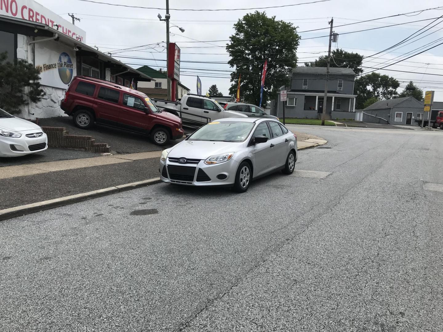 2014 Silver /Gray Ford Focus S Sedan (1FADP3E29EL) with an 2.0L L4 DOHC 16V engine, Automatic transmission, located at 577 Chester Pike, Prospect Park, PA, 19076, (610) 237-1015, 39.886154, -75.302338 - 2014 Ford Focus: Only 93k miles, new PA inspection great on gas, SUPER CLEAN, runs LIKE NEW! This vehicle comes inspected and has been given a bumper to bumper safety check. It is very clean, reliable, and well maintained. We offer a unique pay plan that is known for being the easiest and fastest - Photo#1