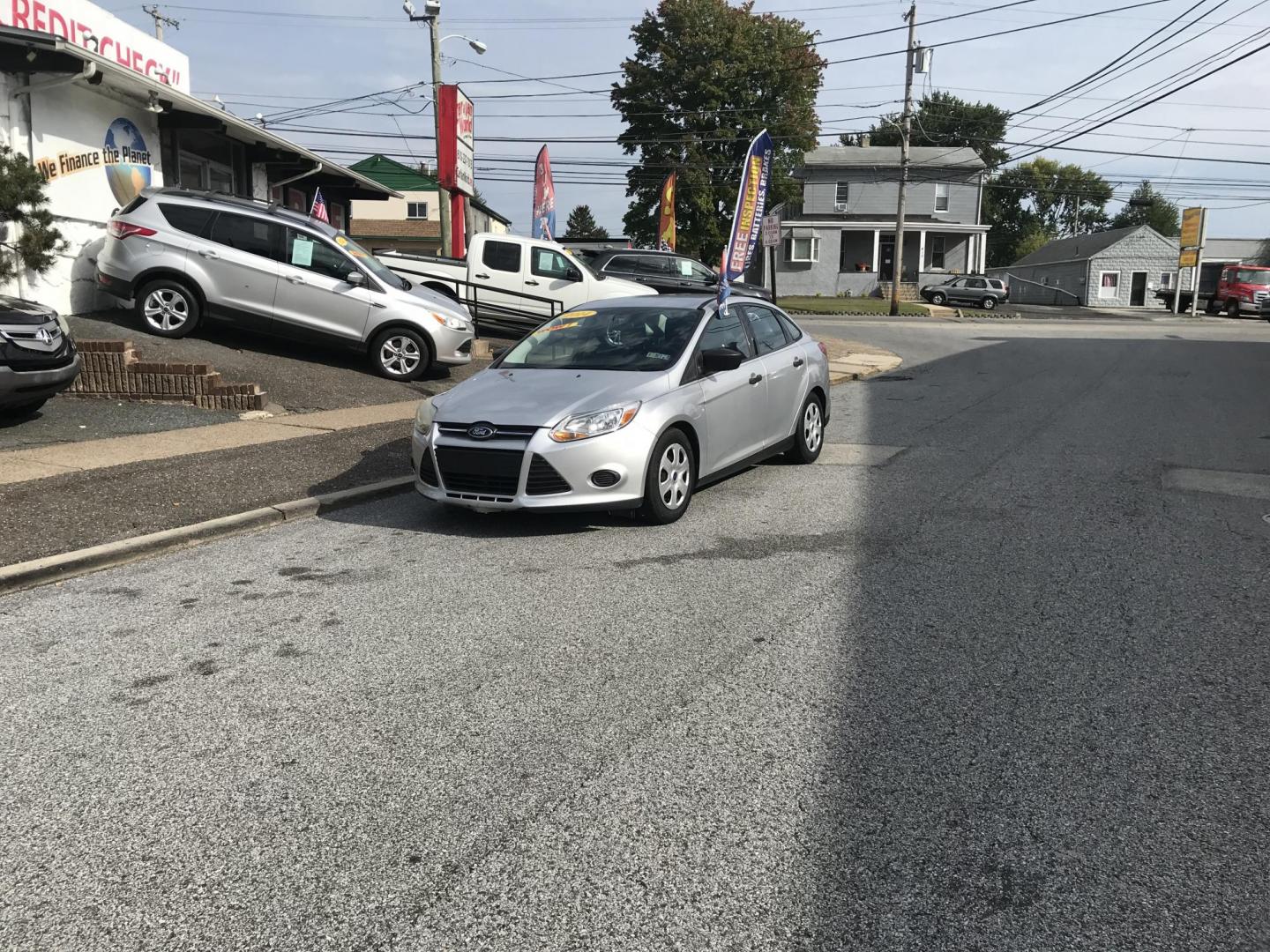 2014 Silver /Gray Ford Focus S Sedan (1FADP3E29EL) with an 2.0L L4 DOHC 16V engine, Automatic transmission, located at 577 Chester Pike, Prospect Park, PA, 19076, (610) 237-1015, 39.886154, -75.302338 - 2014 Ford Focus: Only 94k miles, new PA inspection great on gas, SUPER CLEAN, runs LIKE NEW! This vehicle comes inspected and has been given a bumper to bumper safety check. It is very clean, reliable, and well maintained. We offer a unique pay plan that is known for being the easiest and fastest - Photo#1