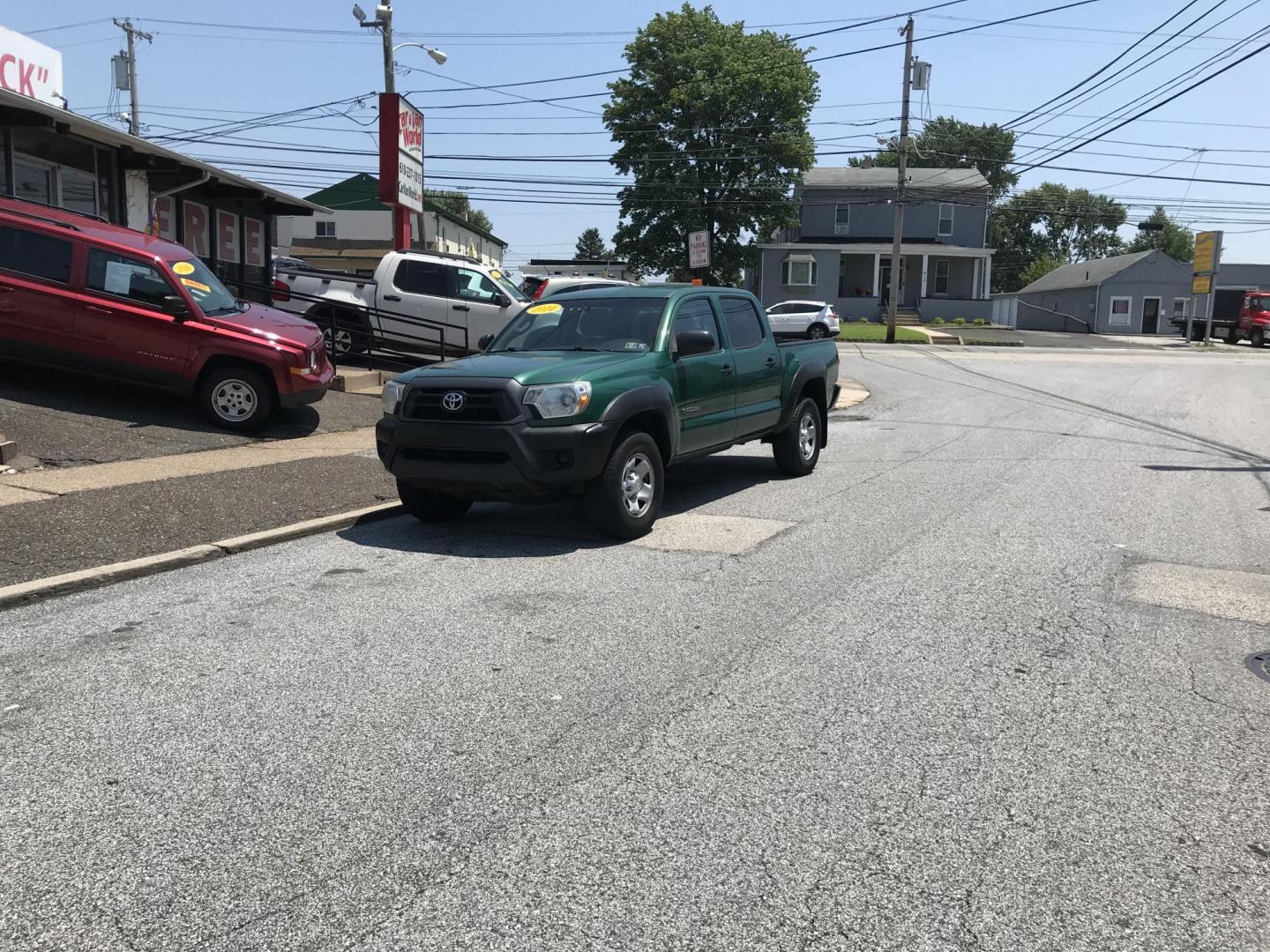 2014 Green /Black Toyota Tacoma Double Cab V6 4WD (5TFLU4EN2EX) with an 4.0L V6 DOHC 24V engine, Automatic transmission, located at 577 Chester Pike, Prospect Park, PA, 19076, (610) 237-1015, 39.886154, -75.302338 - 2014 Toyota Tacoma: Double Cab, 4x4, new PA inspection, runs STRONG! This vehicle comes inspected and has been given a bumper to bumper safety check. It is very clean, reliable, and well maintained. We offer a unique pay plan that is known for being the easiest and fastest financing option in the - Photo#1