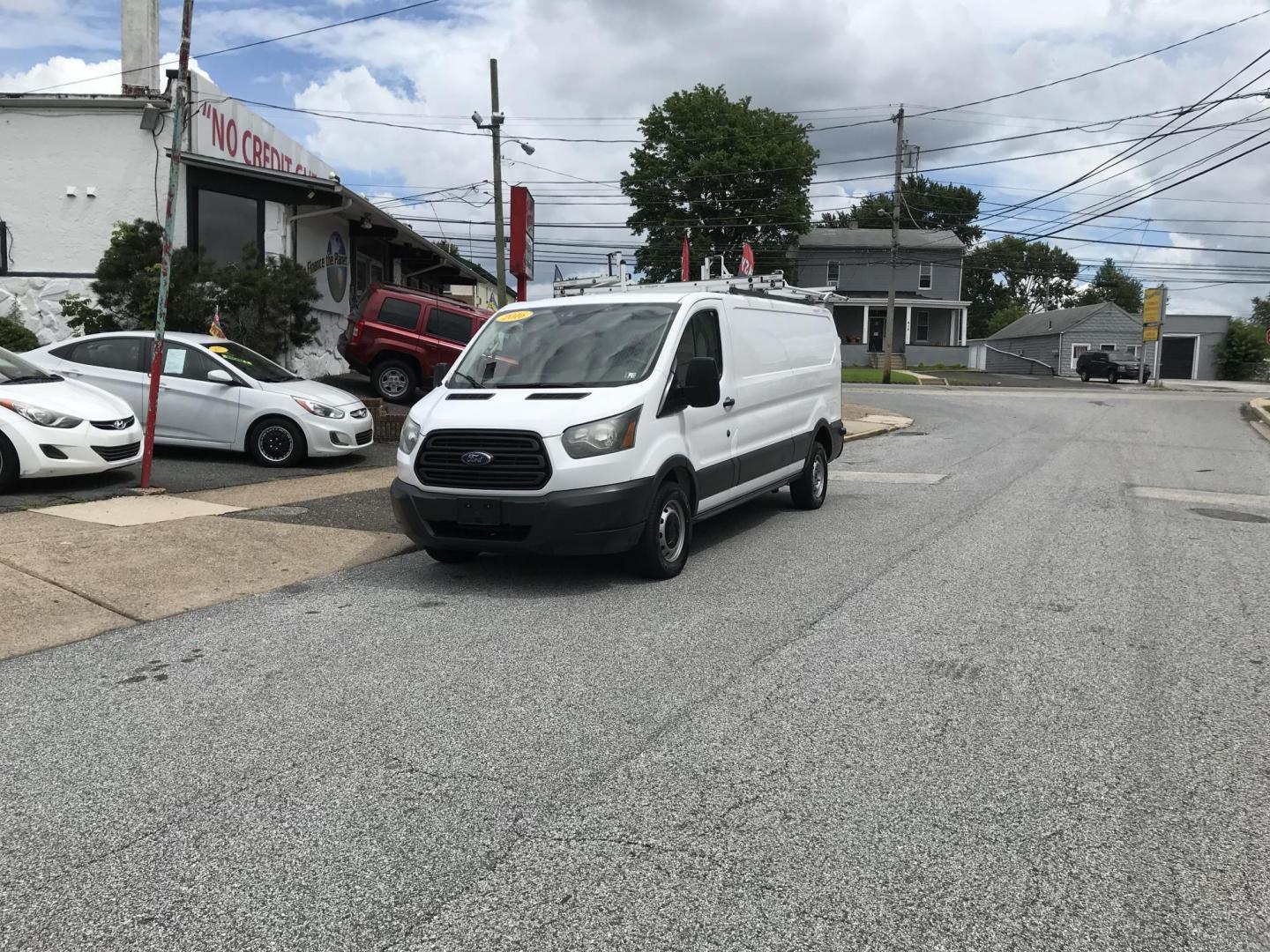 2016 White /Gray Ford Transit 250 Van Low Roof 60/40 Pass. 148-in. WB (1FTYR2ZM8GK) with an 3.7L V6 DOHC 24V engine, 6A transmission, located at 577 Chester Pike, Prospect Park, PA, 19076, (610) 237-1015, 39.886154, -75.302338 - 2016 Ford Transit 250: Extended body, dual drop down ladder racks, multiple pieces of shelving, partition, no side or rear windows, new PA inspection, FLEET MAINTAINED! This vehicle comes inspected and has been given a bumper to bumper safety check. It is very clean, reliable, and well maintained - Photo#1