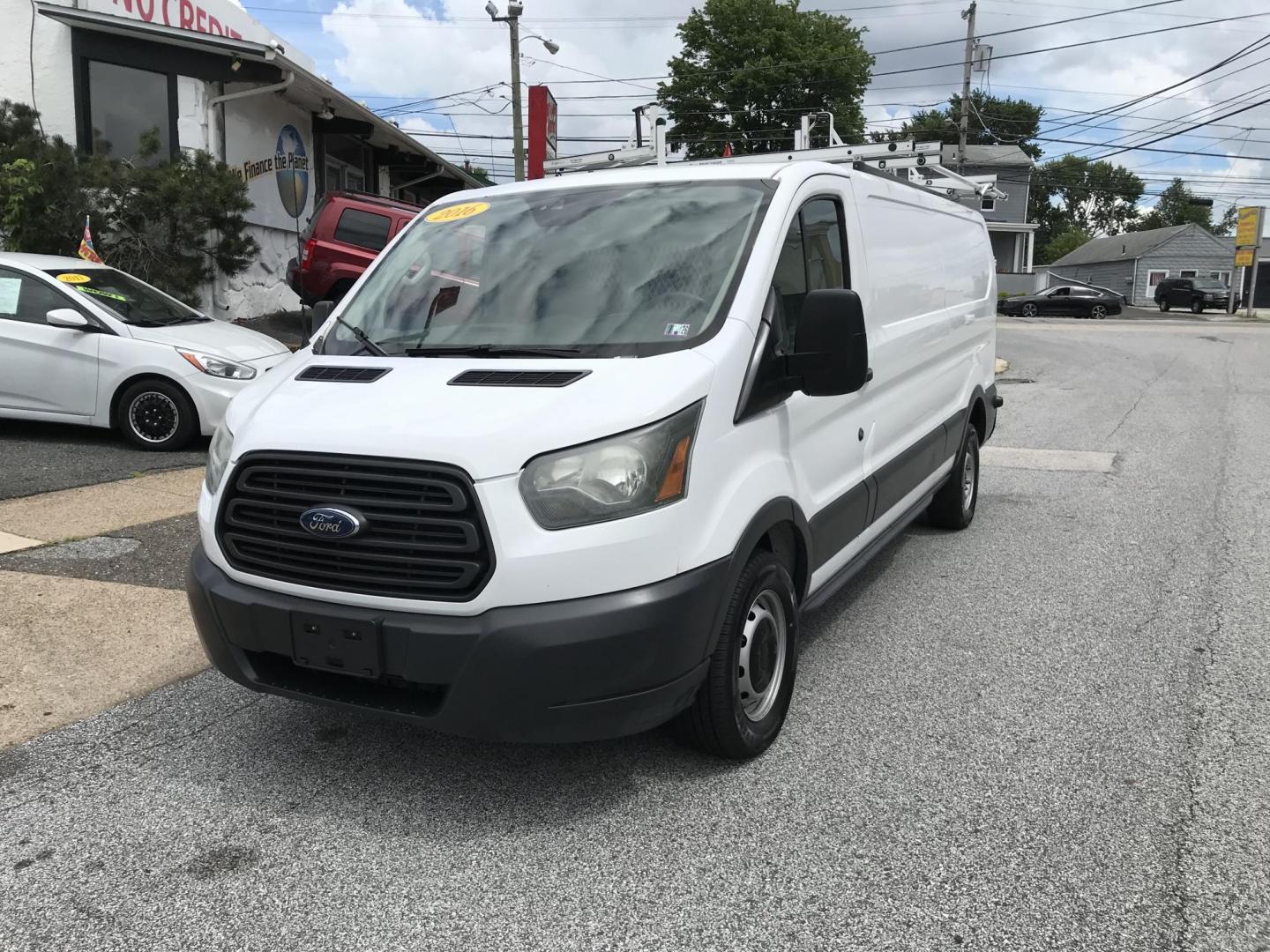 2016 White /Gray Ford Transit 250 Van Low Roof 60/40 Pass. 148-in. WB (1FTYR2ZM8GK) with an 3.7L V6 DOHC 24V engine, 6A transmission, located at 577 Chester Pike, Prospect Park, PA, 19076, (610) 237-1015, 39.886154, -75.302338 - 2016 Ford Transit 250: Extended body, dual drop down ladder racks, multiple pieces of shelving, partition, no side or rear windows, new PA inspection, FLEET MAINTAINED! This vehicle comes inspected and has been given a bumper to bumper safety check. It is very clean, reliable, and well maintained - Photo#2