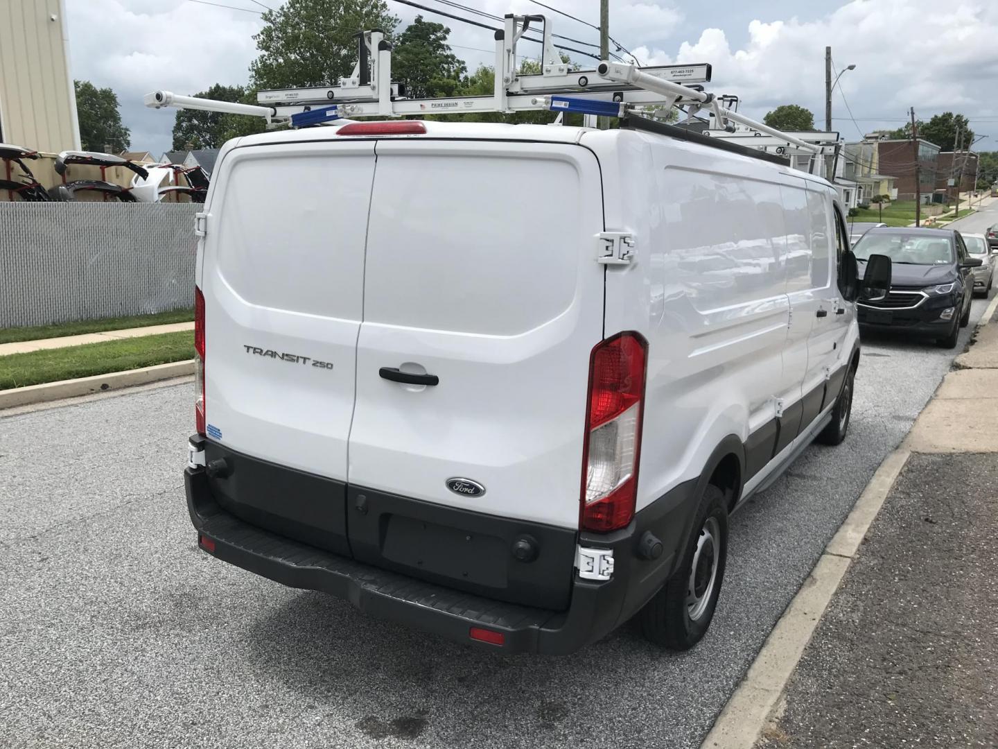 2016 White /Gray Ford Transit 250 Van Low Roof 60/40 Pass. 148-in. WB (1FTYR2ZM8GK) with an 3.7L V6 DOHC 24V engine, 6A transmission, located at 577 Chester Pike, Prospect Park, PA, 19076, (610) 237-1015, 39.886154, -75.302338 - 2016 Ford Transit 250: Extended body, dual drop down ladder racks, multiple pieces of shelving, partition, no side or rear windows, new PA inspection, FLEET MAINTAINED! This vehicle comes inspected and has been given a bumper to bumper safety check. It is very clean, reliable, and well maintained - Photo#4