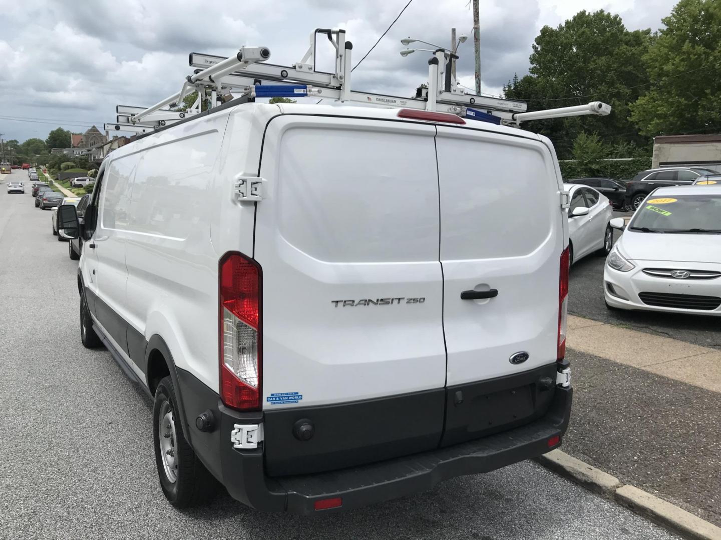 2016 White /Gray Ford Transit 250 Van Low Roof 60/40 Pass. 148-in. WB (1FTYR2ZM8GK) with an 3.7L V6 DOHC 24V engine, 6A transmission, located at 577 Chester Pike, Prospect Park, PA, 19076, (610) 237-1015, 39.886154, -75.302338 - 2016 Ford Transit 250: Extended body, dual drop down ladder racks, multiple pieces of shelving, partition, no side or rear windows, new PA inspection, FLEET MAINTAINED! This vehicle comes inspected and has been given a bumper to bumper safety check. It is very clean, reliable, and well maintained - Photo#5