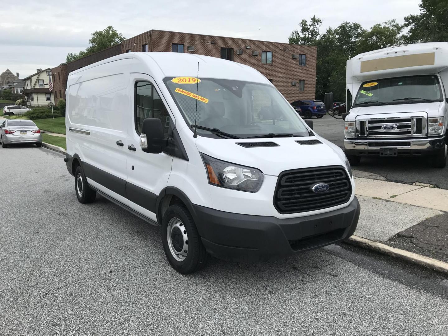 2019 White /Gray Ford Transit 250 Van Med. Roof w/Sliding Pass. 148-in. WB (1FTYR2CMXKK) with an 3.7L V6 DOHC 24V engine, 6A transmission, located at 577 Chester Pike, Prospect Park, PA, 19076, (610) 237-1015, 39.886154, -75.302338 - Photo#2