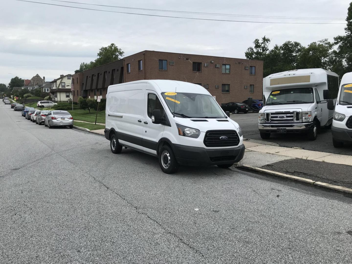 2019 White /Gray Ford Transit 250 Van Med. Roof w/Sliding Pass. 148-in. WB (1FTYR2CMXKK) with an 3.7L V6 DOHC 24V engine, 6A transmission, located at 577 Chester Pike, Prospect Park, PA, 19076, (610) 237-1015, 39.886154, -75.302338 - Photo#1