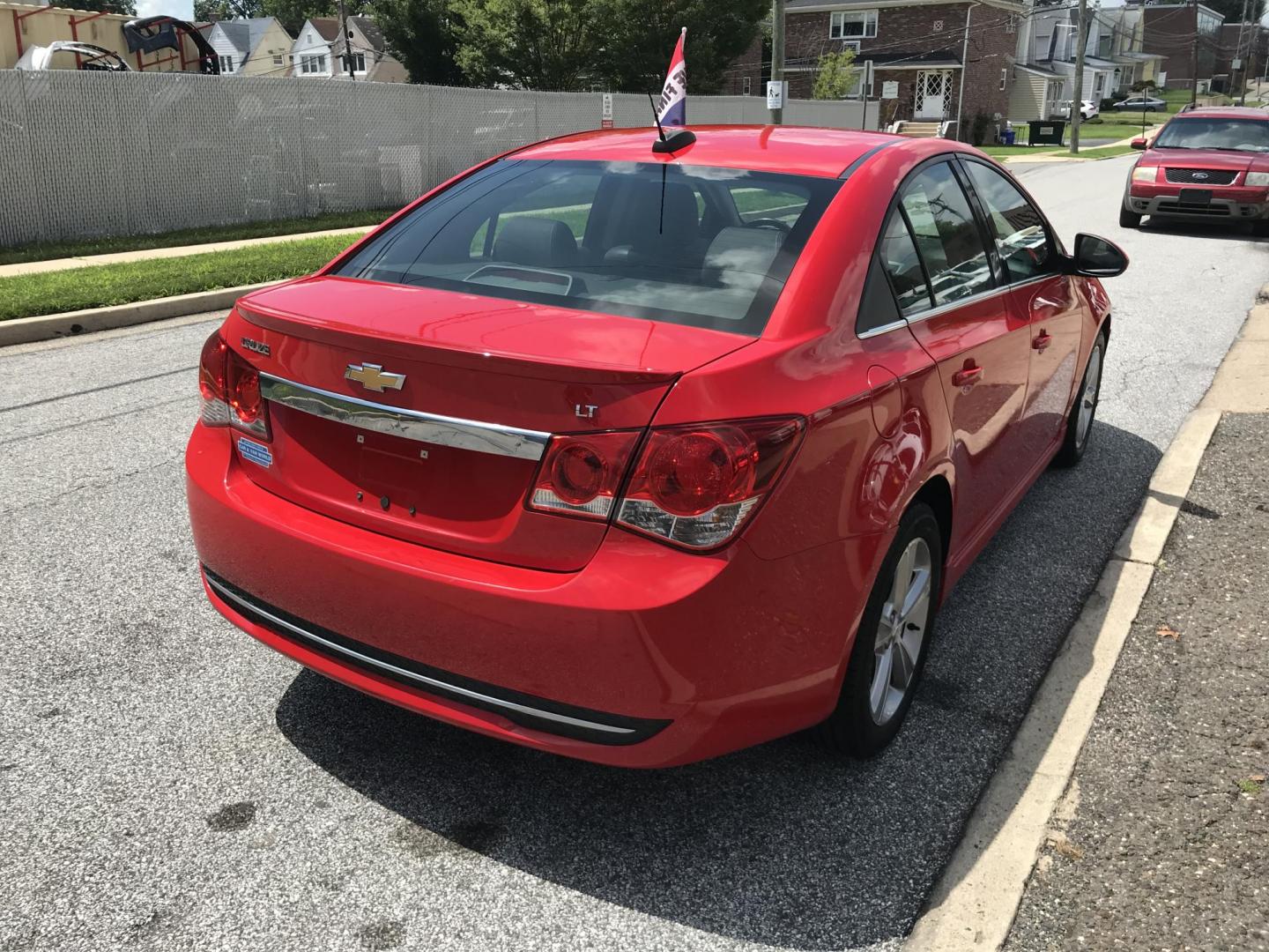 2015 Red /Black Chevrolet Cruze 2LT Auto (1G1PE5SB1F7) with an 1.4L L4 DOHC 16V TURBO engine, 6-Speed Automatic transmission, located at 577 Chester Pike, Prospect Park, PA, 19076, (610) 237-1015, 39.886154, -75.302338 - 2015 Chevrolet Cruze 2LT: Only 102k miles, great on gas, black leather interior, SUPER CLEAN, runs LIKE NEW! This vehicle comes inspected and has been given a bumper to bumper safety check. It is very clean, reliable, and well maintained. We offer a unique pay plan that is known for being the eas - Photo#4