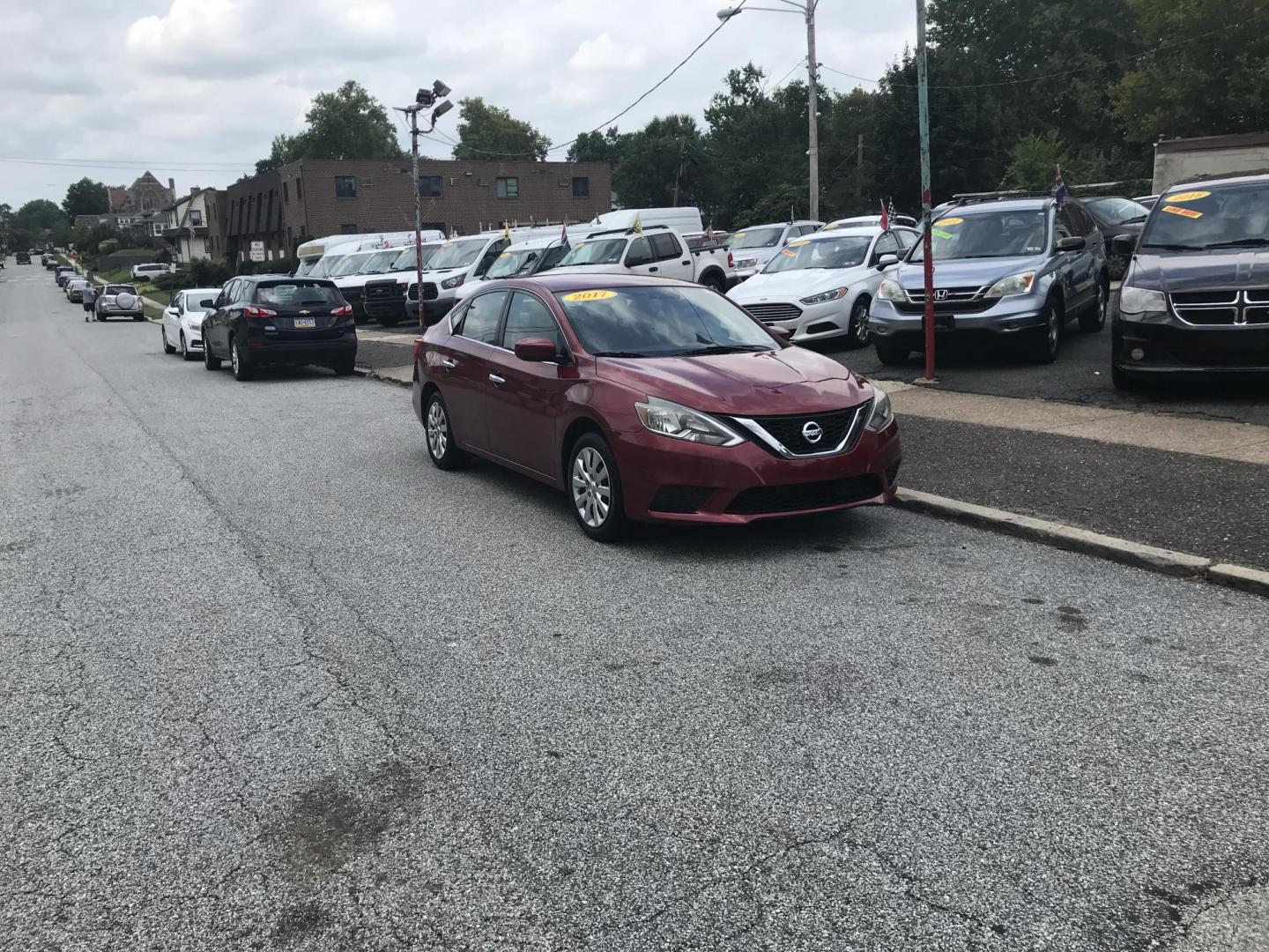 2017 Red /Black Nissan Sentra S (3N1AB7AP9HL) with an 1.8L L4 SFI DOHC 16V engine, Automatic transmission, located at 577 Chester Pike, Prospect Park, PA, 19076, (610) 237-1015, 39.886154, -75.302338 - 2017 Nissan Sentra: Only 103k miles, backup camera, new PA inspection, SUPER CLEAN, runs LIKE NEW! This vehicle comes inspected and has been given a bumper to bumper safety check. It is very clean, reliable, and well maintained. We offer a unique pay plan that is known for being the easiest and f - Photo#1