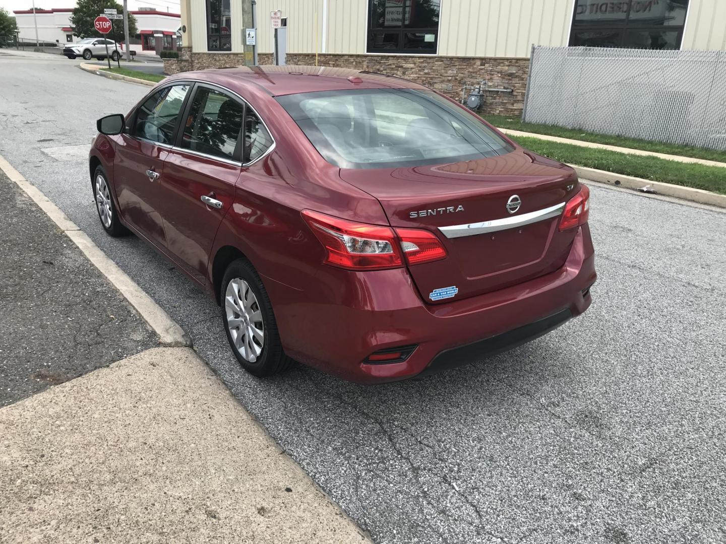 2017 Red /Black Nissan Sentra S (3N1AB7AP9HL) with an 1.8L L4 SFI DOHC 16V engine, Automatic transmission, located at 577 Chester Pike, Prospect Park, PA, 19076, (610) 237-1015, 39.886154, -75.302338 - 2017 Nissan Sentra: Only 103k miles, backup camera, new PA inspection, SUPER CLEAN, runs LIKE NEW! This vehicle comes inspected and has been given a bumper to bumper safety check. It is very clean, reliable, and well maintained. We offer a unique pay plan that is known for being the easiest and f - Photo#5