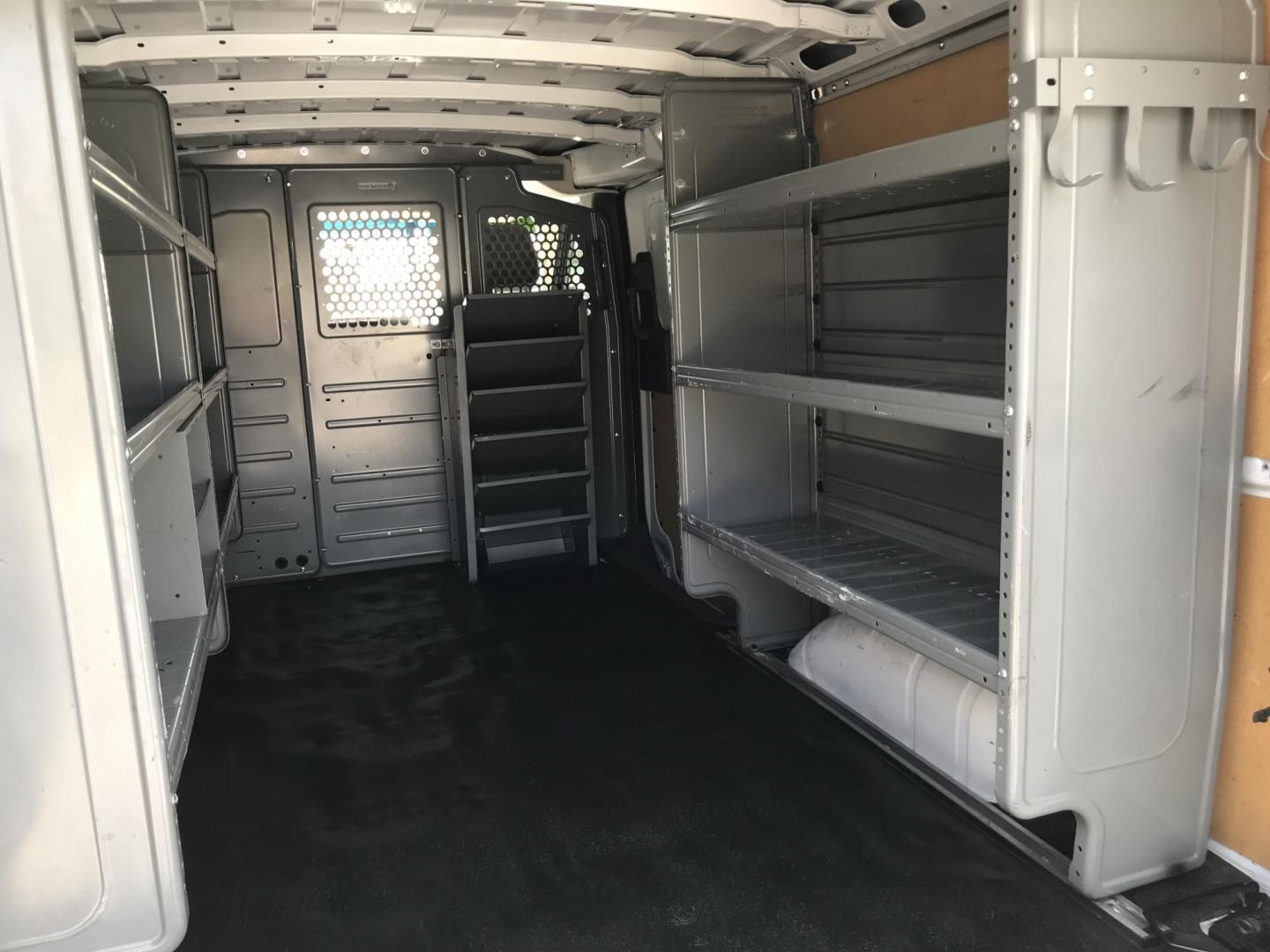 2020 White /Gray Nissan NV Cargo 1500 SV (1N6BF0KM9LN) with an 4.0L V6 engine, 5A transmission, located at 577 Chester Pike, Prospect Park, PA, 19076, (610) 237-1015, 39.886154, -75.302338 - 2020 Nissan NV 1500: No side or rear windows, backup camera, new PA inspection, shelving, FLEET MAINTAINED, runs LIKE NEW! This vehicle comes inspected and has been given a bumper to bumper safety check. It is very clean, reliable, and well maintained. We offer a unique pay plan that is known for - Photo#20