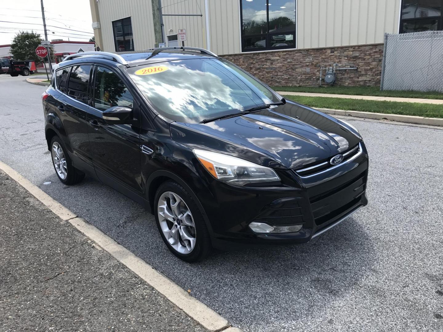 2016 Black /Black Ford Escape Titanium 4WD (1FMCU9JX2GU) with an 1.6L L4 DOHC 16V engine, 6-Speed Automatic transmission, located at 577 Chester Pike, Prospect Park, PA, 19076, (610) 237-1015, 39.886154, -75.302338 - 2016 Ford Escape Titanium: Only 106k miles, backup camera, sunroof, new PA inspection, SUPER CLEAN, runs LIKE NEW! This vehicle comes inspected and has been given a bumper to bumper safety check. It is very clean, reliable, and well maintained. We offer a unique pay plan that is known for being t - Photo#3