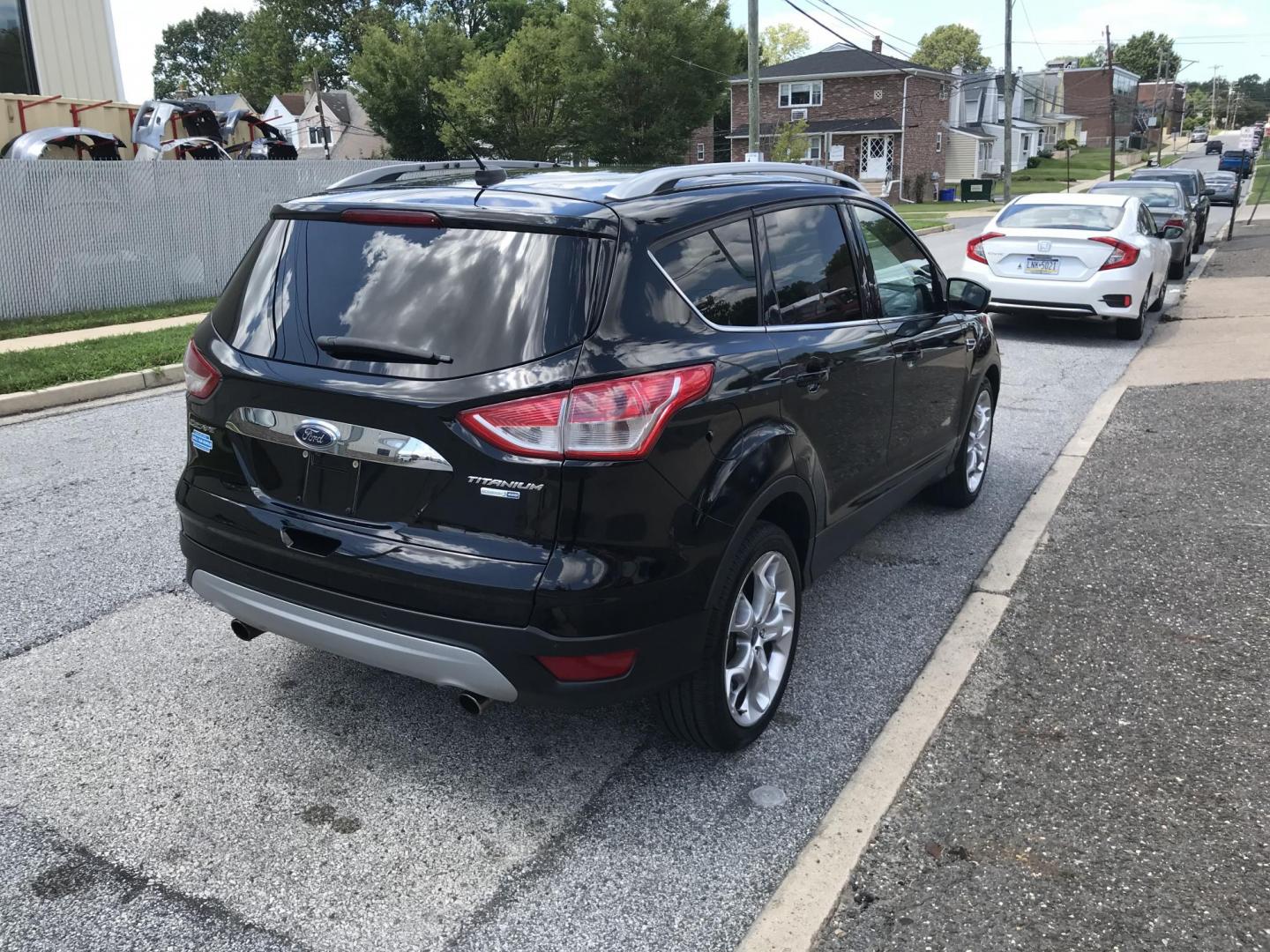 2016 Black /Black Ford Escape Titanium 4WD (1FMCU9JX2GU) with an 1.6L L4 DOHC 16V engine, 6-Speed Automatic transmission, located at 577 Chester Pike, Prospect Park, PA, 19076, (610) 237-1015, 39.886154, -75.302338 - 2016 Ford Escape Titanium: Only 106k miles, backup camera, sunroof, new PA inspection, SUPER CLEAN, runs LIKE NEW! This vehicle comes inspected and has been given a bumper to bumper safety check. It is very clean, reliable, and well maintained. We offer a unique pay plan that is known for being t - Photo#4