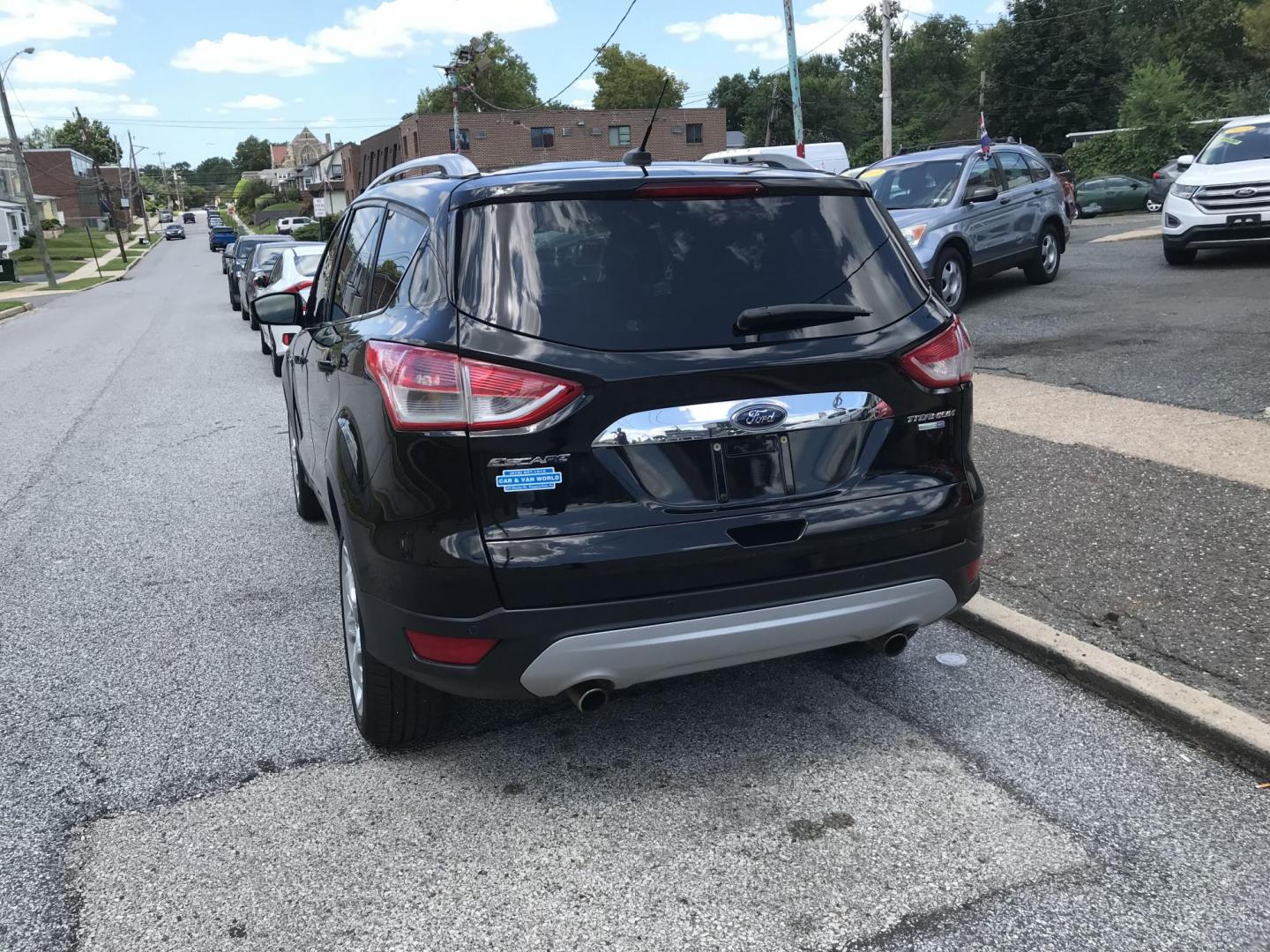2016 Black /Black Ford Escape Titanium 4WD (1FMCU9JX2GU) with an 1.6L L4 DOHC 16V engine, 6-Speed Automatic transmission, located at 577 Chester Pike, Prospect Park, PA, 19076, (610) 237-1015, 39.886154, -75.302338 - 2016 Ford Escape Titanium: Only 106k miles, backup camera, sunroof, new PA inspection, SUPER CLEAN, runs LIKE NEW! This vehicle comes inspected and has been given a bumper to bumper safety check. It is very clean, reliable, and well maintained. We offer a unique pay plan that is known for being t - Photo#5