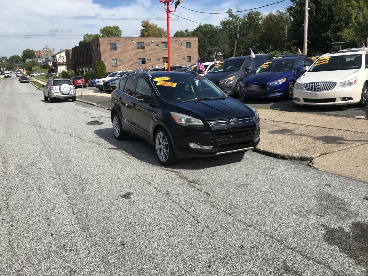 2016 Black /Black Ford Escape Titanium 4WD (1FMCU9JX2GU) with an 1.6L L4 DOHC 16V engine, 6-Speed Automatic transmission, located at 577 Chester Pike, Prospect Park, PA, 19076, (610) 237-1015, 39.886154, -75.302338 - 2016 Ford Escape Titanium: Only 109k miles, backup camera, sunroof, new PA inspection, SUPER CLEAN, runs LIKE NEW! This vehicle comes inspected and has been given a bumper to bumper safety check. It is very clean, reliable, and well maintained. We offer a unique pay plan that is known for being t- Photo#1