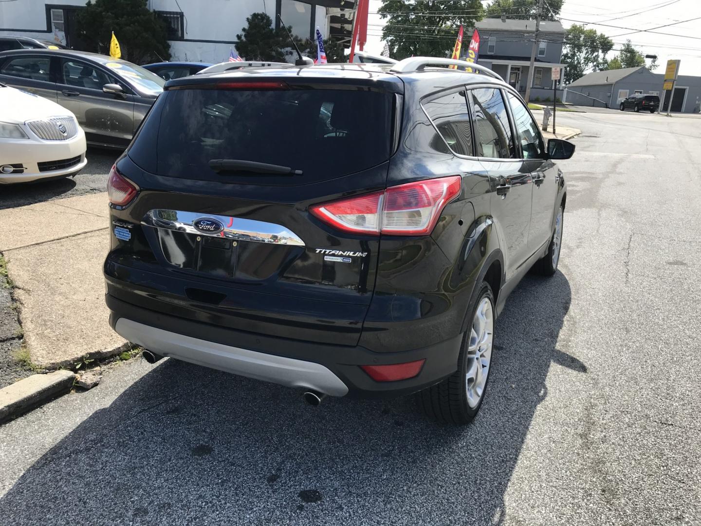 2016 Black /Black Ford Escape Titanium 4WD (1FMCU9JX2GU) with an 1.6L L4 DOHC 16V engine, 6-Speed Automatic transmission, located at 577 Chester Pike, Prospect Park, PA, 19076, (610) 237-1015, 39.886154, -75.302338 - 2016 Ford Escape Titanium: Only 109k miles, backup camera, sunroof, new PA inspection, SUPER CLEAN, runs LIKE NEW! This vehicle comes inspected and has been given a bumper to bumper safety check. It is very clean, reliable, and well maintained. We offer a unique pay plan that is known for being t- Photo#7