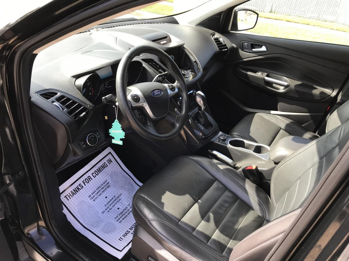2016 Black /Black Ford Escape Titanium 4WD (1FMCU9JX2GU) with an 1.6L L4 DOHC 16V engine, 6-Speed Automatic transmission, located at 577 Chester Pike, Prospect Park, PA, 19076, (610) 237-1015, 39.886154, -75.302338 - 2016 Ford Escape Titanium: Only 109k miles, backup camera, sunroof, new PA inspection, SUPER CLEAN, runs LIKE NEW! This vehicle comes inspected and has been given a bumper to bumper safety check. It is very clean, reliable, and well maintained. We offer a unique pay plan that is known for being t- Photo#9