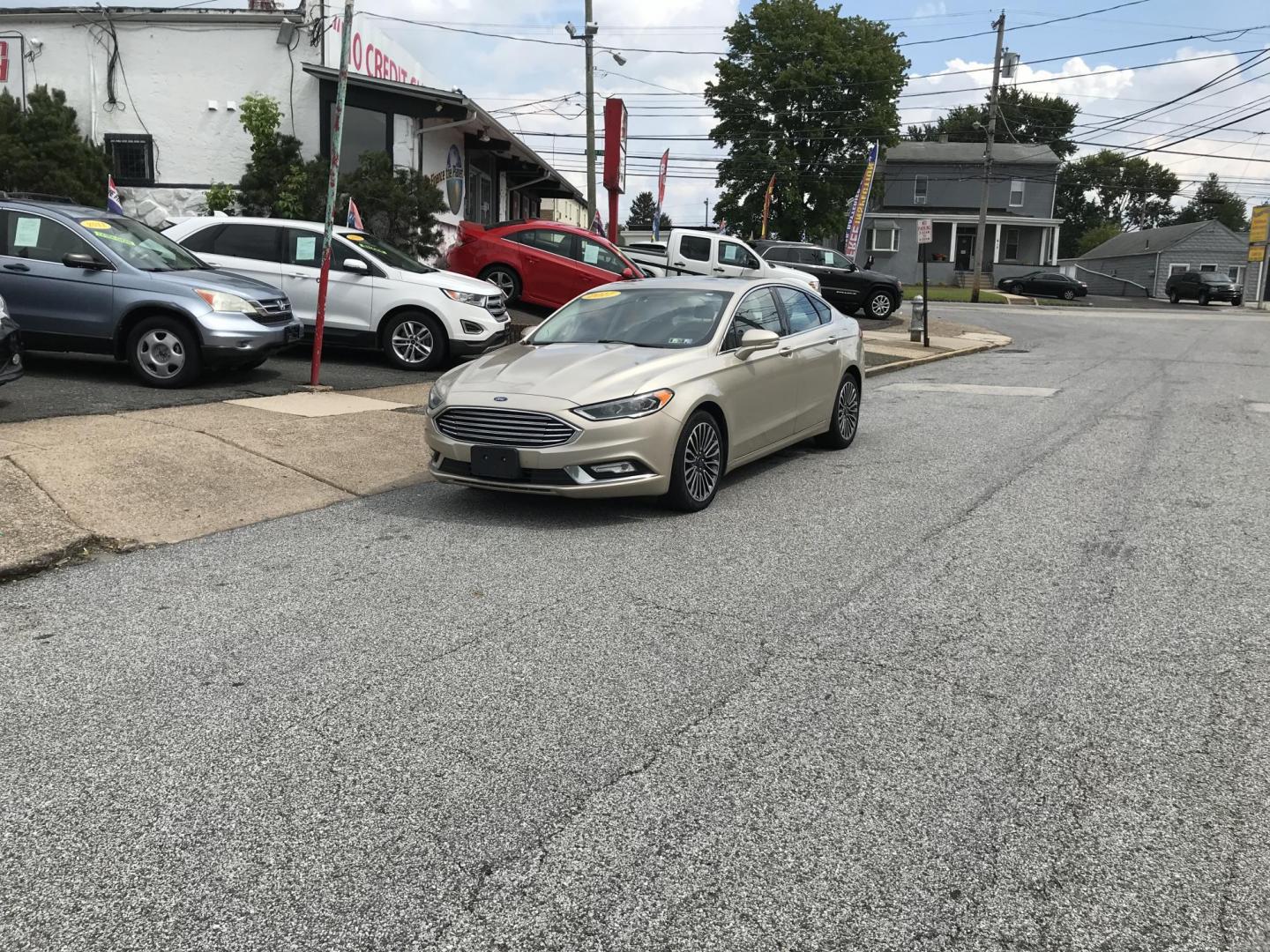 2017 Gold /Tan Ford Fusion SE (3FA6P0H94HR) with an 2.0L L4 DOHC 16V engine, 6A transmission, located at 577 Chester Pike, Prospect Park, PA, 19076, (610) 237-1015, 39.886154, -75.302338 - 2017 Ford Fusion SE: New PA inspection, great on gas, super clean, runs LIKE NEW! This vehicle comes inspected and has been given a bumper to bumper safety check. It is very clean, reliable, and well maintained. We offer a unique pay plan that is known for being the easiest and fastest financing - Photo#1