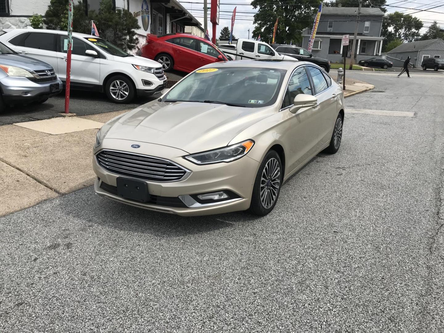 2017 Gold /Tan Ford Fusion SE (3FA6P0H94HR) with an 2.0L L4 DOHC 16V engine, 6A transmission, located at 577 Chester Pike, Prospect Park, PA, 19076, (610) 237-1015, 39.886154, -75.302338 - 2017 Ford Fusion SE: New PA inspection, great on gas, super clean, runs LIKE NEW! This vehicle comes inspected and has been given a bumper to bumper safety check. It is very clean, reliable, and well maintained. We offer a unique pay plan that is known for being the easiest and fastest financing - Photo#2