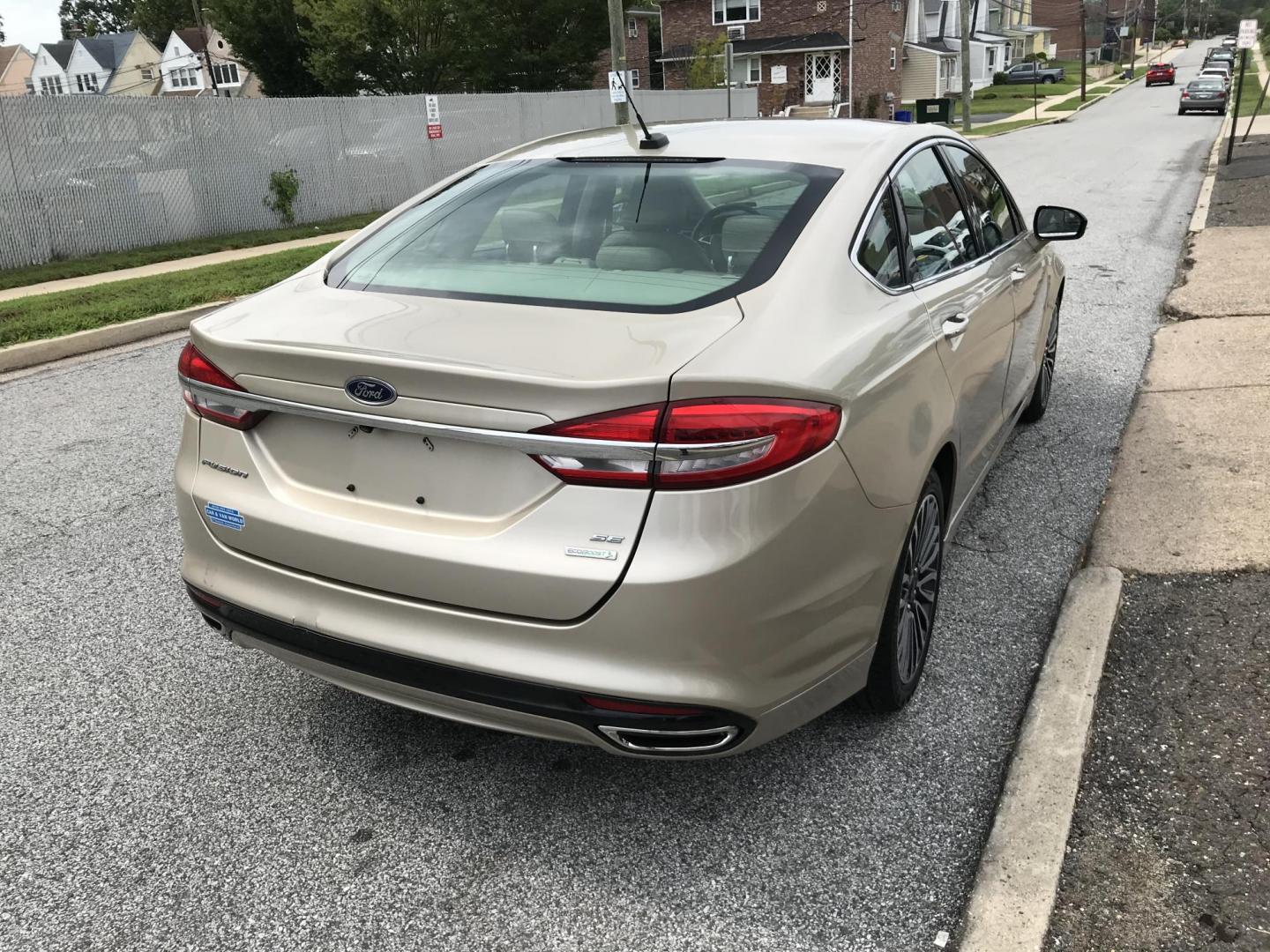 2017 Gold /Tan Ford Fusion SE (3FA6P0H94HR) with an 2.0L L4 DOHC 16V engine, 6A transmission, located at 577 Chester Pike, Prospect Park, PA, 19076, (610) 237-1015, 39.886154, -75.302338 - 2017 Ford Fusion SE: New PA inspection, great on gas, super clean, runs LIKE NEW! This vehicle comes inspected and has been given a bumper to bumper safety check. It is very clean, reliable, and well maintained. We offer a unique pay plan that is known for being the easiest and fastest financing - Photo#4