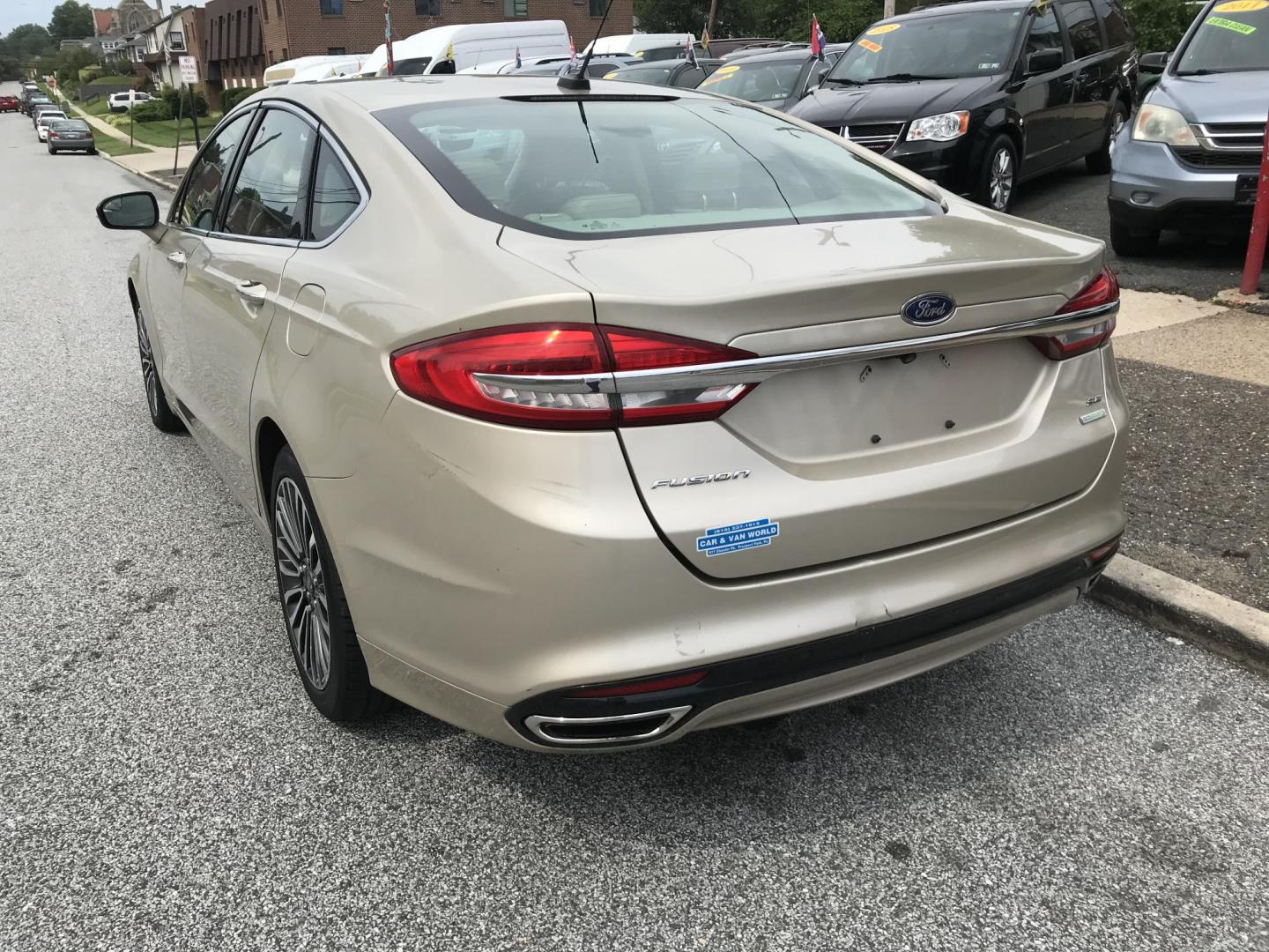 2017 Gold /Tan Ford Fusion SE (3FA6P0H94HR) with an 2.0L L4 DOHC 16V engine, 6A transmission, located at 577 Chester Pike, Prospect Park, PA, 19076, (610) 237-1015, 39.886154, -75.302338 - 2017 Ford Fusion SE: New PA inspection, great on gas, super clean, runs LIKE NEW! This vehicle comes inspected and has been given a bumper to bumper safety check. It is very clean, reliable, and well maintained. We offer a unique pay plan that is known for being the easiest and fastest financing - Photo#5