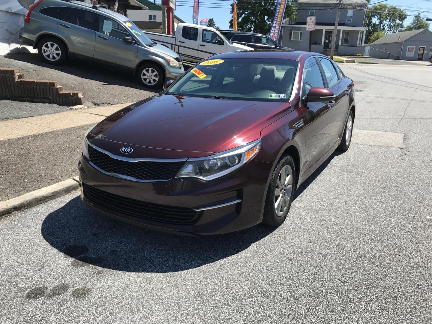 2016 Maroon /Beige Kia Optima LX (5XXGT4L34GG) with an 2.4L L4 DOHC 16V engine, 6A transmission, located at 577 Chester Pike, Prospect Park, PA, 19076, (610) 237-1015, 39.886154, -75.302338 - 2016 Kia Optima LX: Only 125k miles, backup camera, new PA inspection, SUPER CLEAN, runs LIKE NEW! This vehicle comes inspected and has been given a bumper to bumper safety check. It is very clean, reliable, and well maintained. We offer a unique pay plan that is known for being the easiest and f - Photo#2